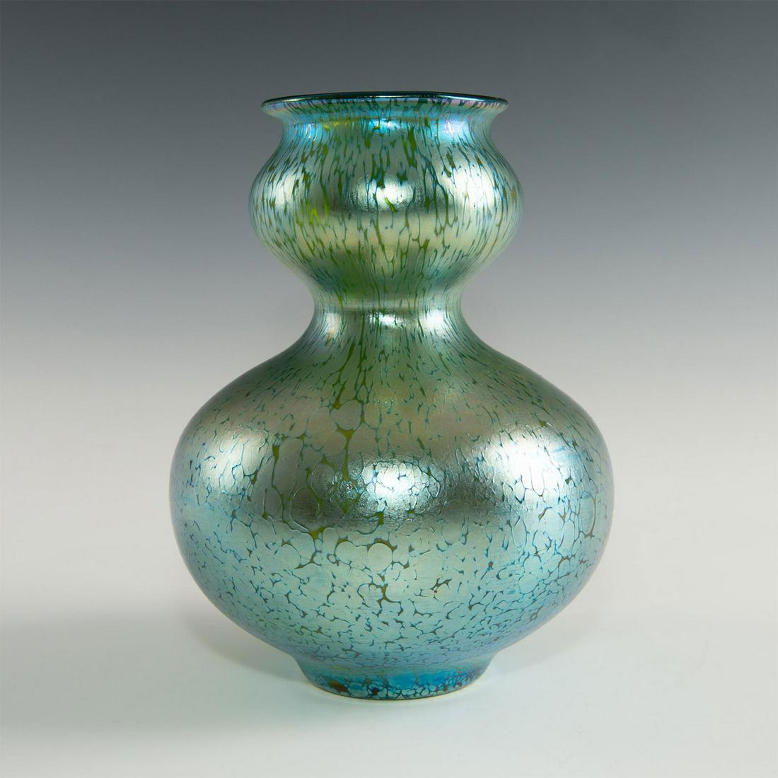 LOETZ PAPILLON DOUBLE GOURD VASE: Dark green with iridescent finish. Unsigned. Nice example of this Loetz Papillon decor double gourd shaped vase. Artist: Loetz Dimensions: 8.5"H Country of Origin: Austria