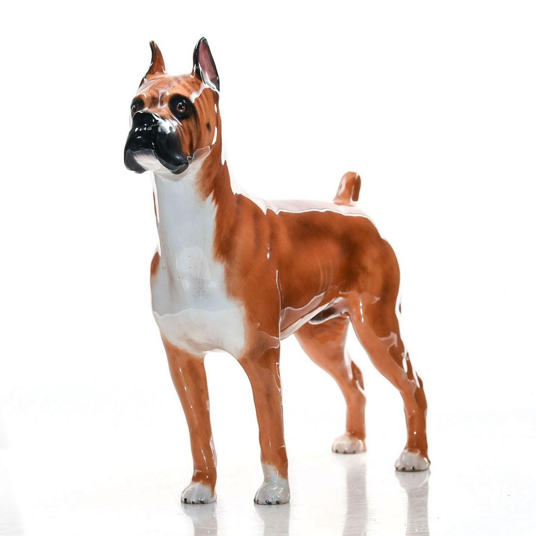 BOXER HN2643 - ROYAL DOULTON DOGS: Royal Doulton Dog, Boxer HN2643 Medium, designed by Peggy Davies. Issued: 1952-1985 Size: 6.5''HColor: Golden brown and white Developed in Germany, the Boxers are stocky, medium- Sized, short-haired d
