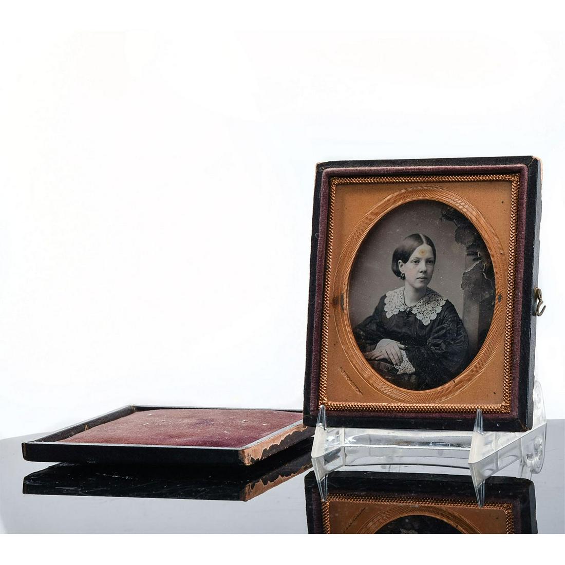 AMERICANA UNION CASE AND SAMUEL BROADBENT DAGUERREOTYPE: Rare. Attributed to Scovill Manufacturing. Floral and scrolls. A very rare and unusual Union case with original daguerreotype image within, produced c. 1855 with an original daguerreotype by Samuel Br