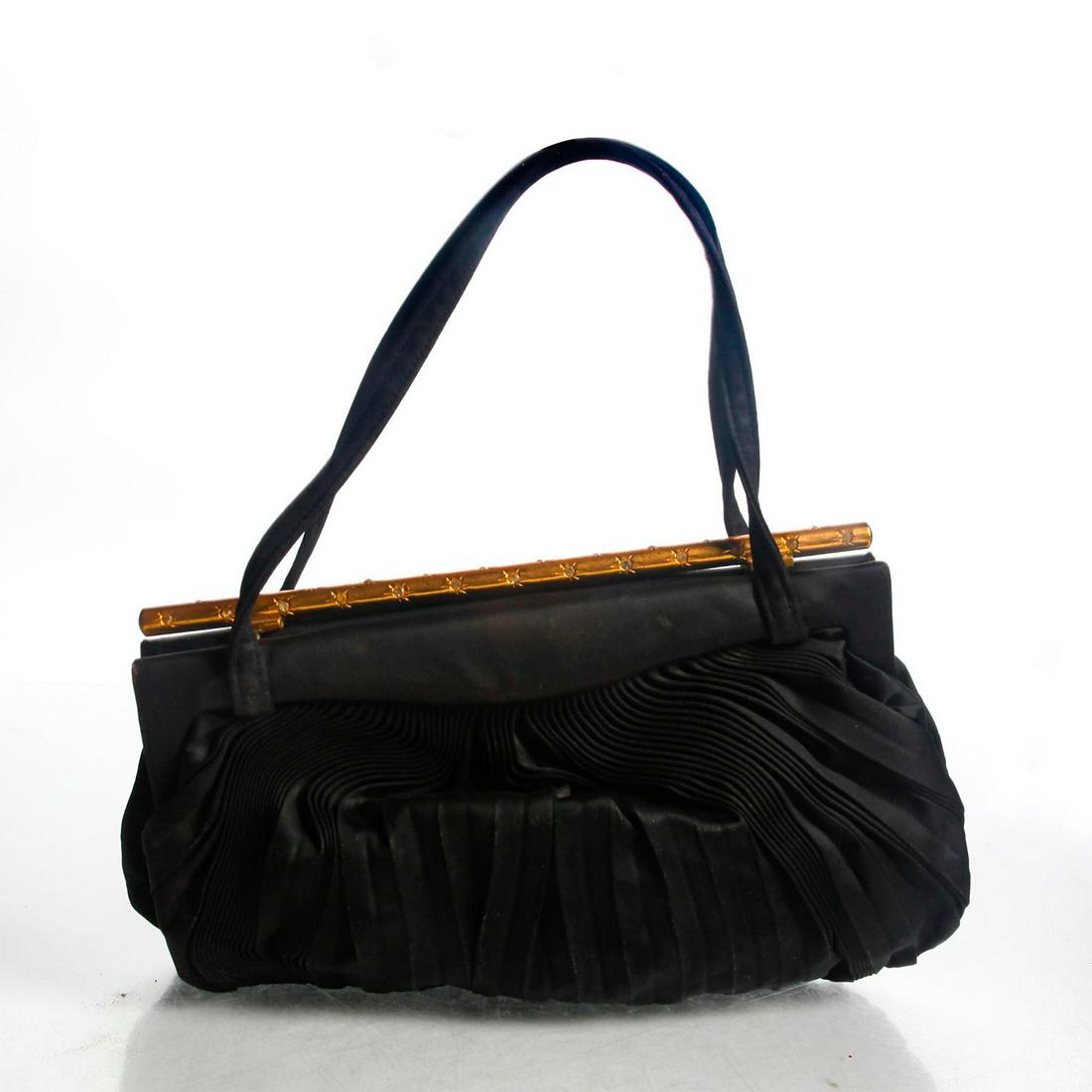 KORET EVENING HANDBAG WITH CHANGE PURSE: Koret fabric evening handbag. Gold with rhinestone closure bar. Koret imprint inside and on change purse. Dimensions: 7"H x 9"W Manufacturer: Koret