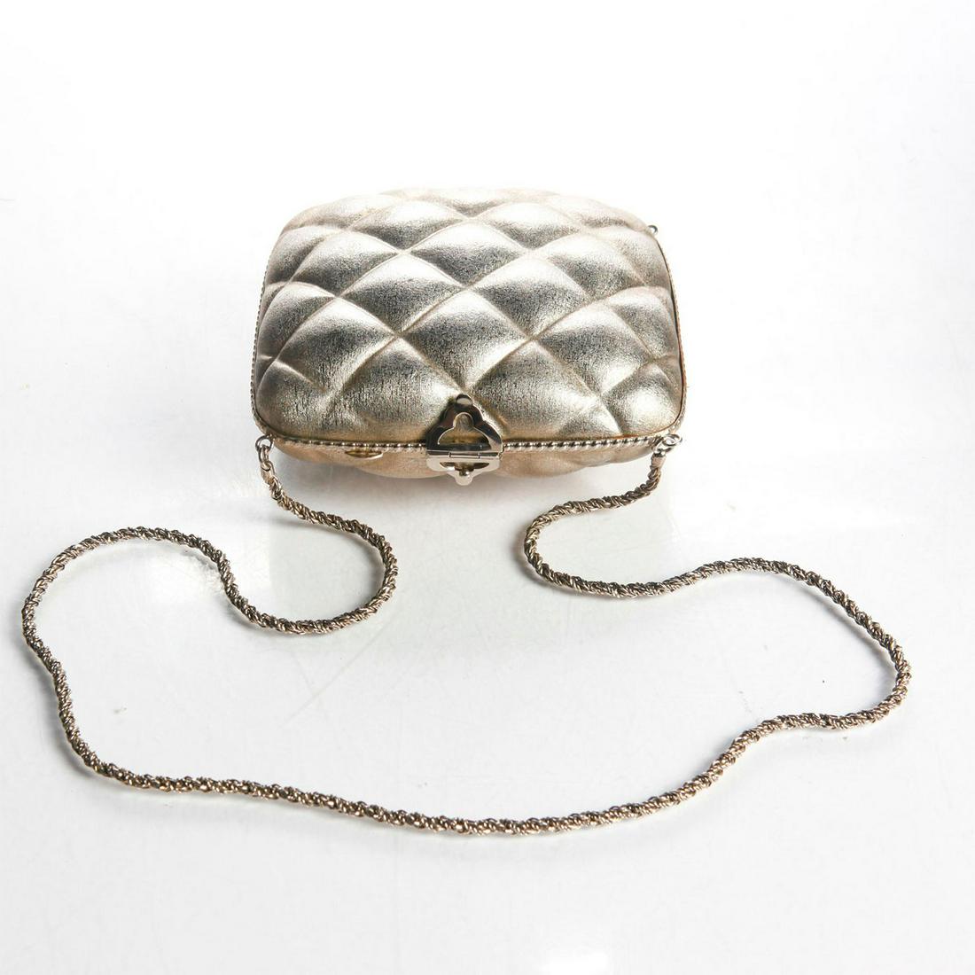 ROSENFELD METAL ITALIAN HANDBAG: Mid-century silver color quilted metal Rosenfeld handbag. Label inside 'Rosenfeld Made in Italy'. Inner lining has come free. Chain shoulder strap 15.5"L. Dimensions: 5.75"H x 6.25"W Manufacturer: Har