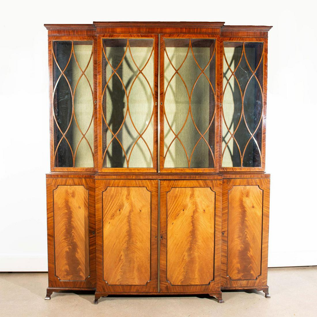 MONUMENTAL EARLY TWO-TIER CHINA CABINET: Edwardian design in solid wood; 3 piece top w. fretted windows. Hand-planed hardwood backs, vintage construction, and glass lined open frame windows on the top 3 decks; crotch grain veneer fronts. Age