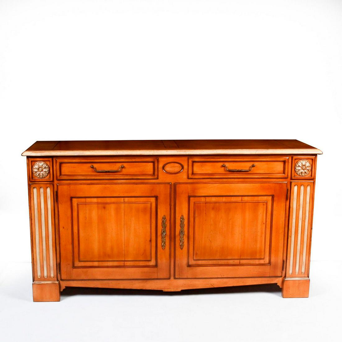ROCHE BOBOIS SIDE BOARD WITH DRAWERS: Blonde finish, layer shelf within; relief florets and fluting. Large piece from the esteemed maker, with bronzed hardware and ample storage. Total weight approx. 170lb. Issued: 20th c. Dimensions: 70"