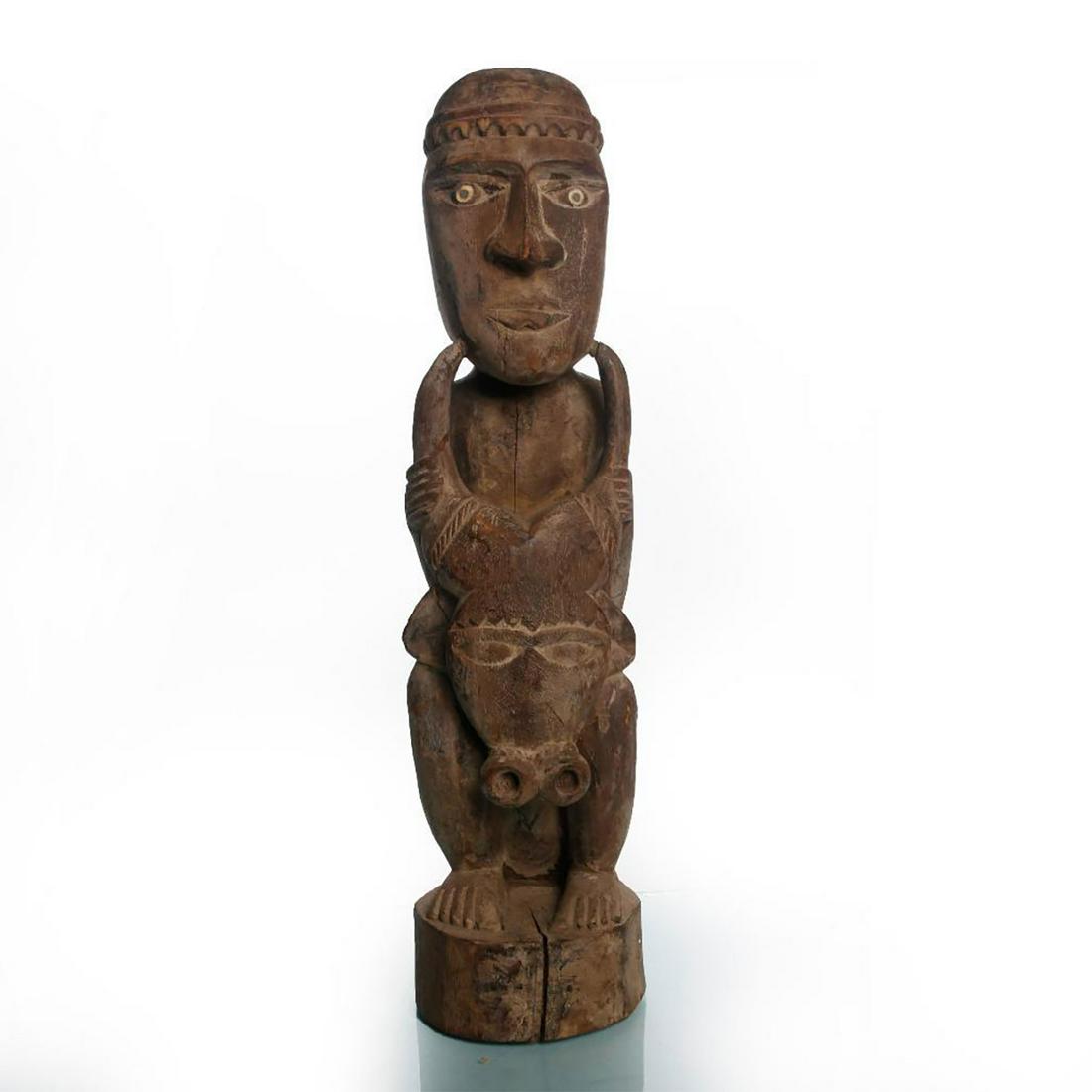 AFRICAN TRIBAL WOODEN SCULPTURE OF MAN WITH BULLS HEAD: Antique traditional hand carved wooden Africana art. Issued: 1970 c. Dimensions: 23"H