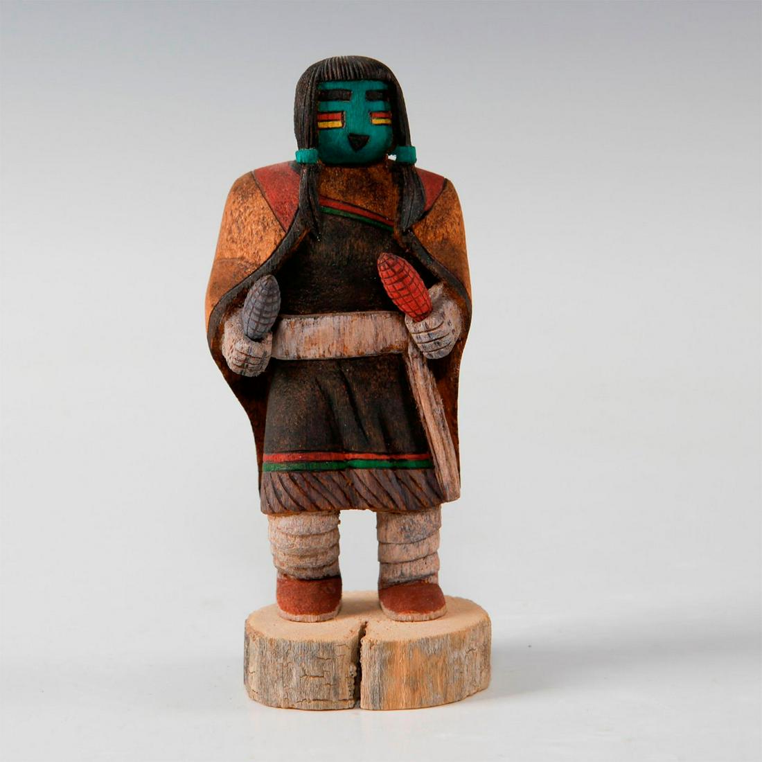 NATIVE AMERICAN TEWA MAIDEN KACHINA DOLL: Carved wooden figure of a Tewa maiden. Doll is depicted with ponytails and ceremonial wear. Maiden is dancing as a part of a Hopi festival. Artist: Ken Nunez Issued: 20th c. Dimensions: 4.25"H Country