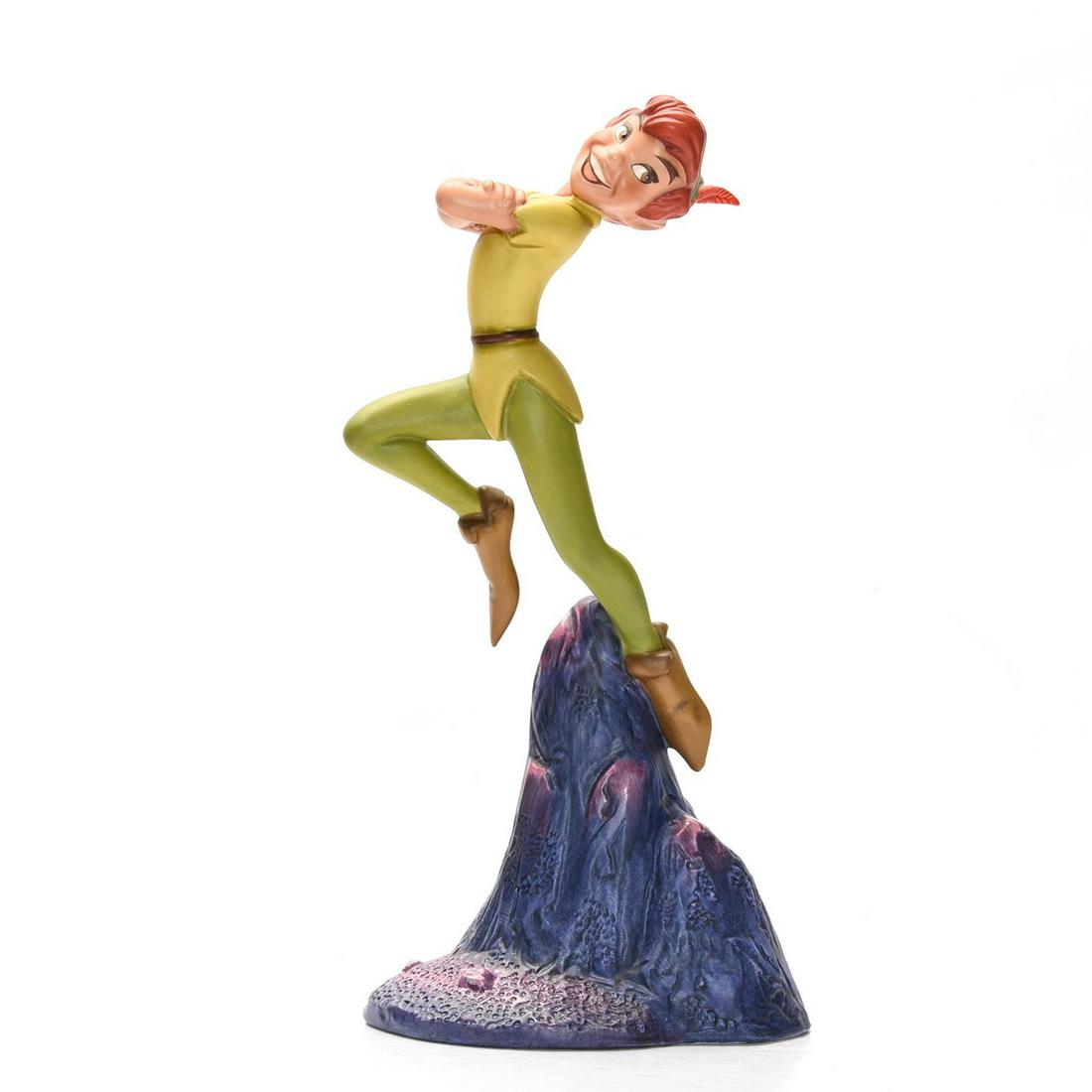 DISNEY CLASSICS FIGURINE, PETER PAN, CERTIFICATE & BOX: Modeled as the flying hero of the 1953 Disney animated feature. Stamped to base WALT DISNEY CLASSICS COLLECTION PETER PAN "NOBODY CALLS PAN A COWARD!" Certificate of Authenticity. Collectors box. Issu