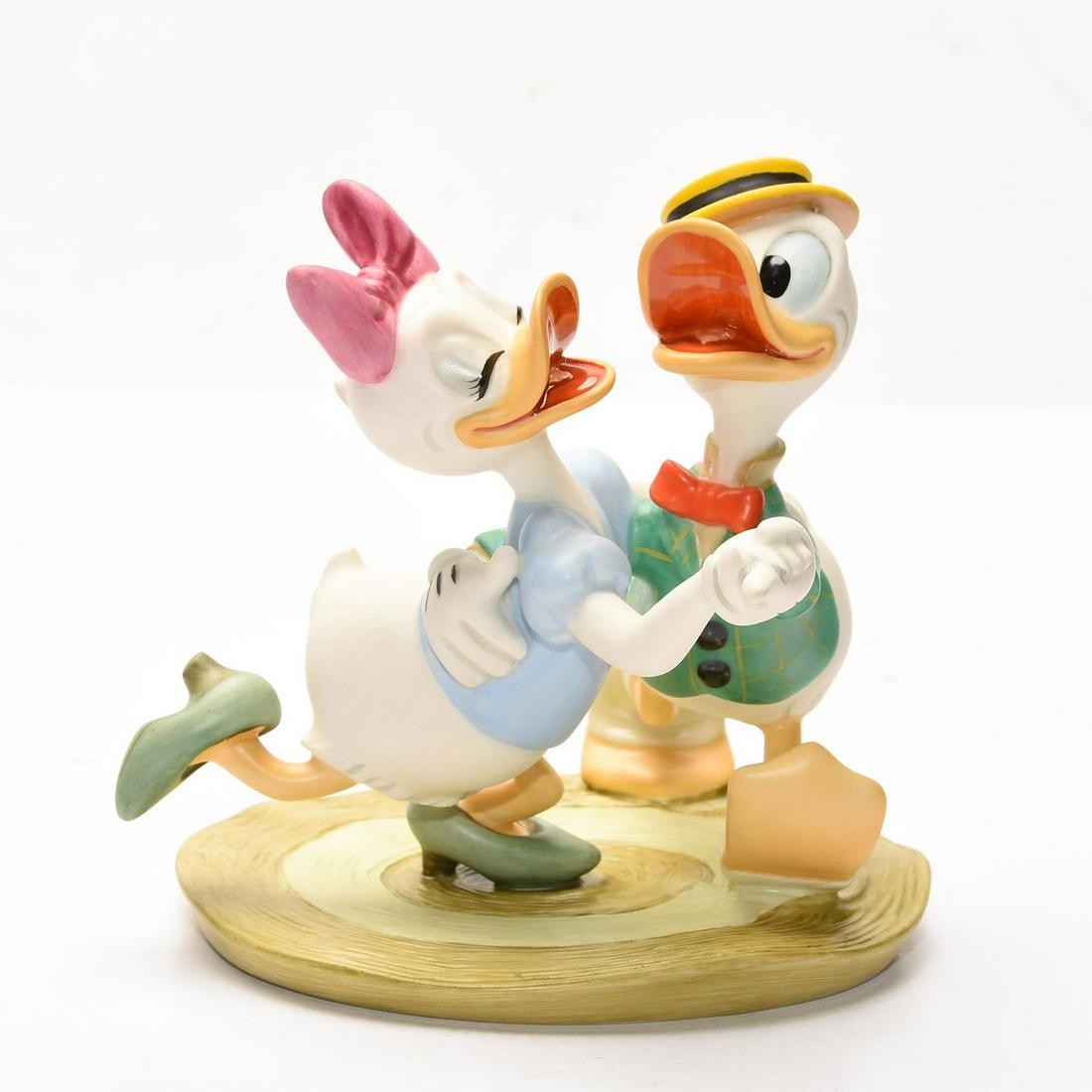 DISNEY CLASSICS GROUP FIGURINE, DAISY AND DONALD DUCK: Limited Edition scene based on 1940 cartoon debut of Daisy Duck. Stamped to base WALT DISNEY CLASSICS COLLECTION MR. DUCK STEPS OUT OH BOY WHAT A JITTERBUG. Limited Edition number with a gold backstam