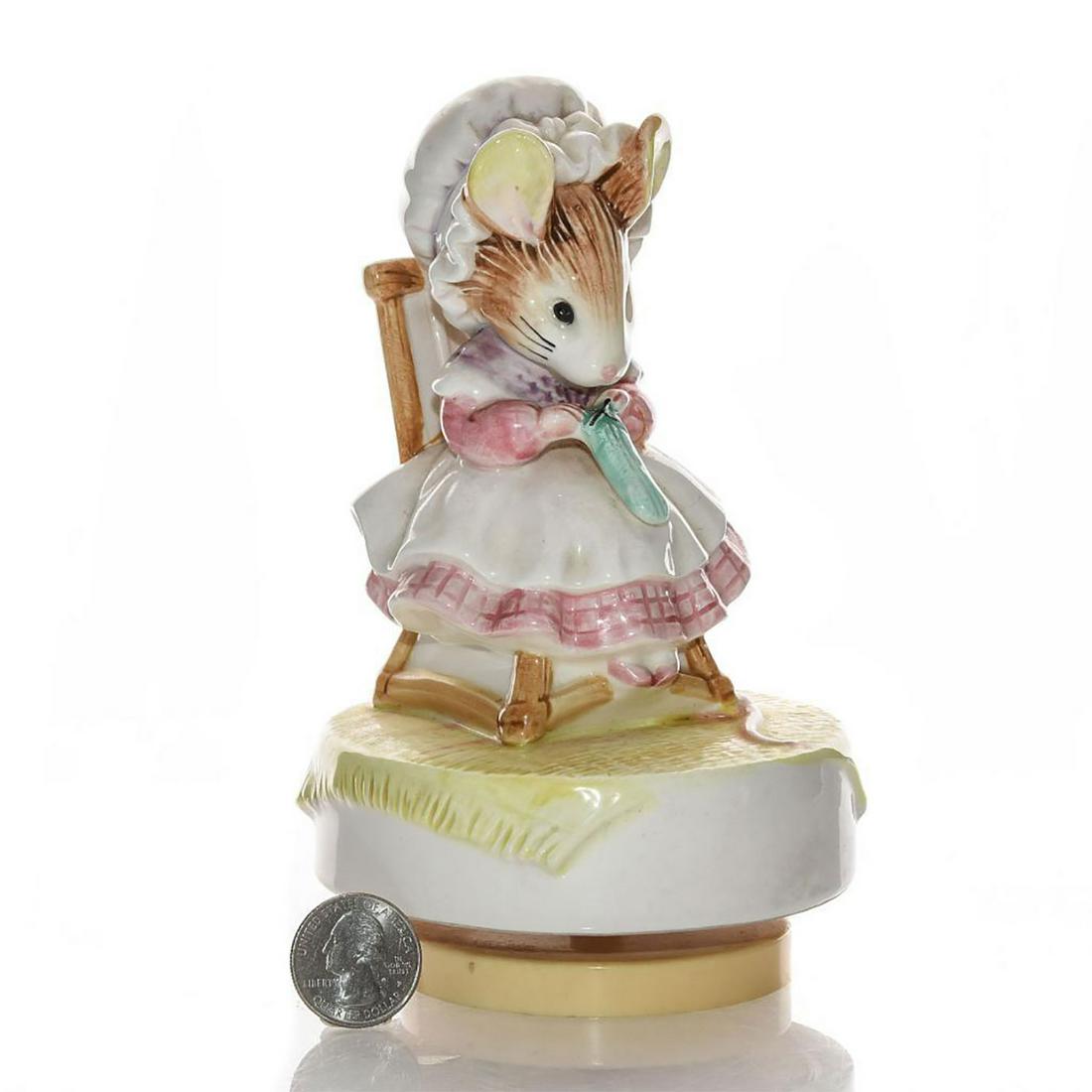 SCHMID BEATRIX POTTER MUSIC BOX: Inscribed to base LITTLE OLD WOMAN WHO LIVED IN A SHOE. Apply Dapply's Nursery Rhyme, spinning music box. Hairline crack to rocking chair. Issued: 20th c. Dimensions: 6.75"H Manufacturer: Schmid by Be