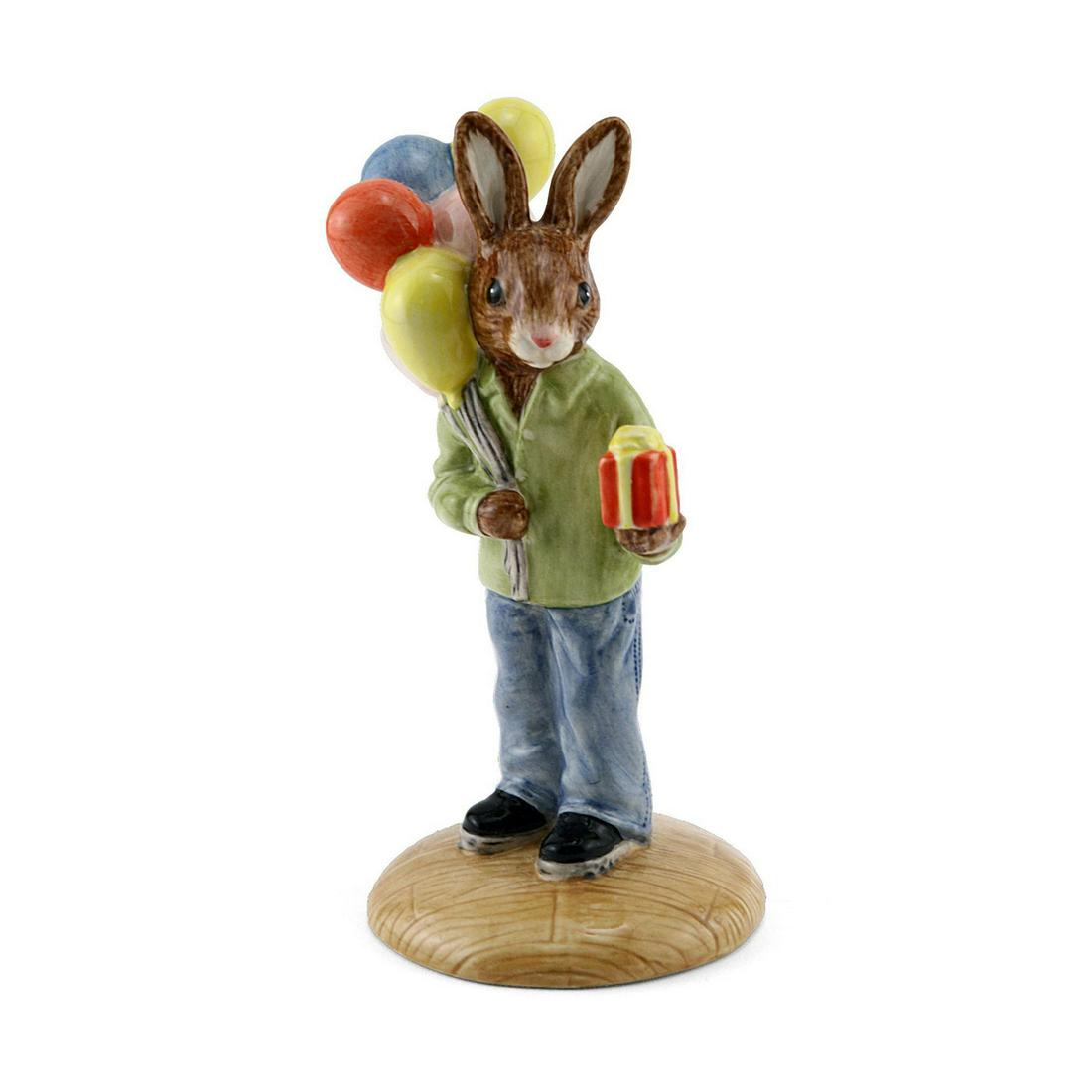 CONGRATULATIONS DB291 - ROYAL DOULTON BUNNYKINS: Royal Doulton Bunnykins, Congratulations Bunnykins DB291 (light blue, green, yellow, red, white, beige, and black coloration). Issued 2003 - present. Size 4.25"H Artist: M. Alcock Issued: 2003 Dimensi