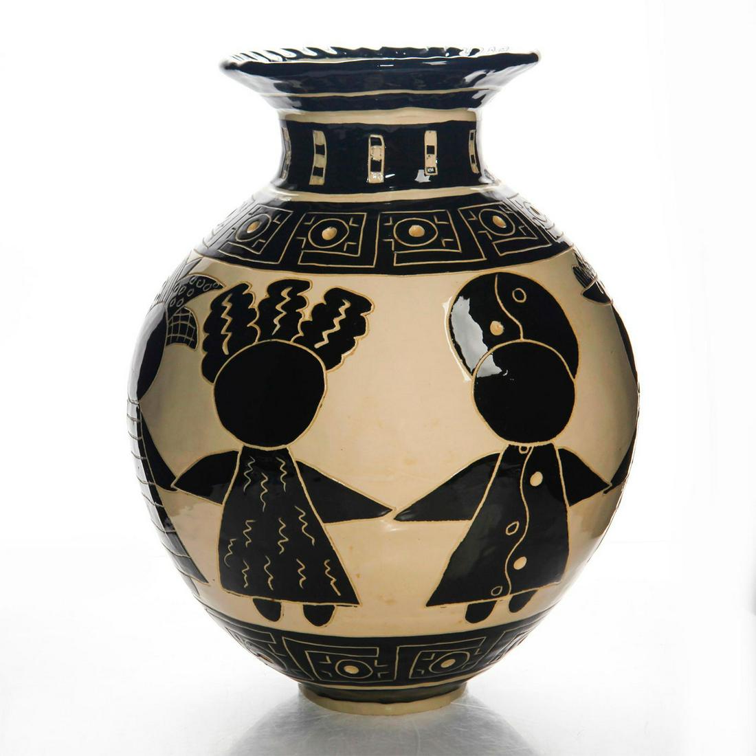 LARGE JANET LOWE CERAMIC COIL VASE: Black and white; depicts carved figures holding hands. Lowe's ceramics celebrate women. Her inspiration comes from Miro, Caribbean culture and ancient petroglyphs. Signed on bottom. Artist: Janet Lowe