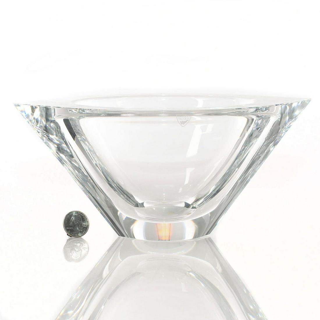 ORREFORS SWEDISH CRYSTAL BOWL: Modernist design, round with pointed sides. Signed to bottom, and has original sticker affixed. Issued: 20th - 21st c. Dimensions: 10.5"L x 8.75"W x 4.75"H Manufacturer: Orrefors Country of Origin: Sw