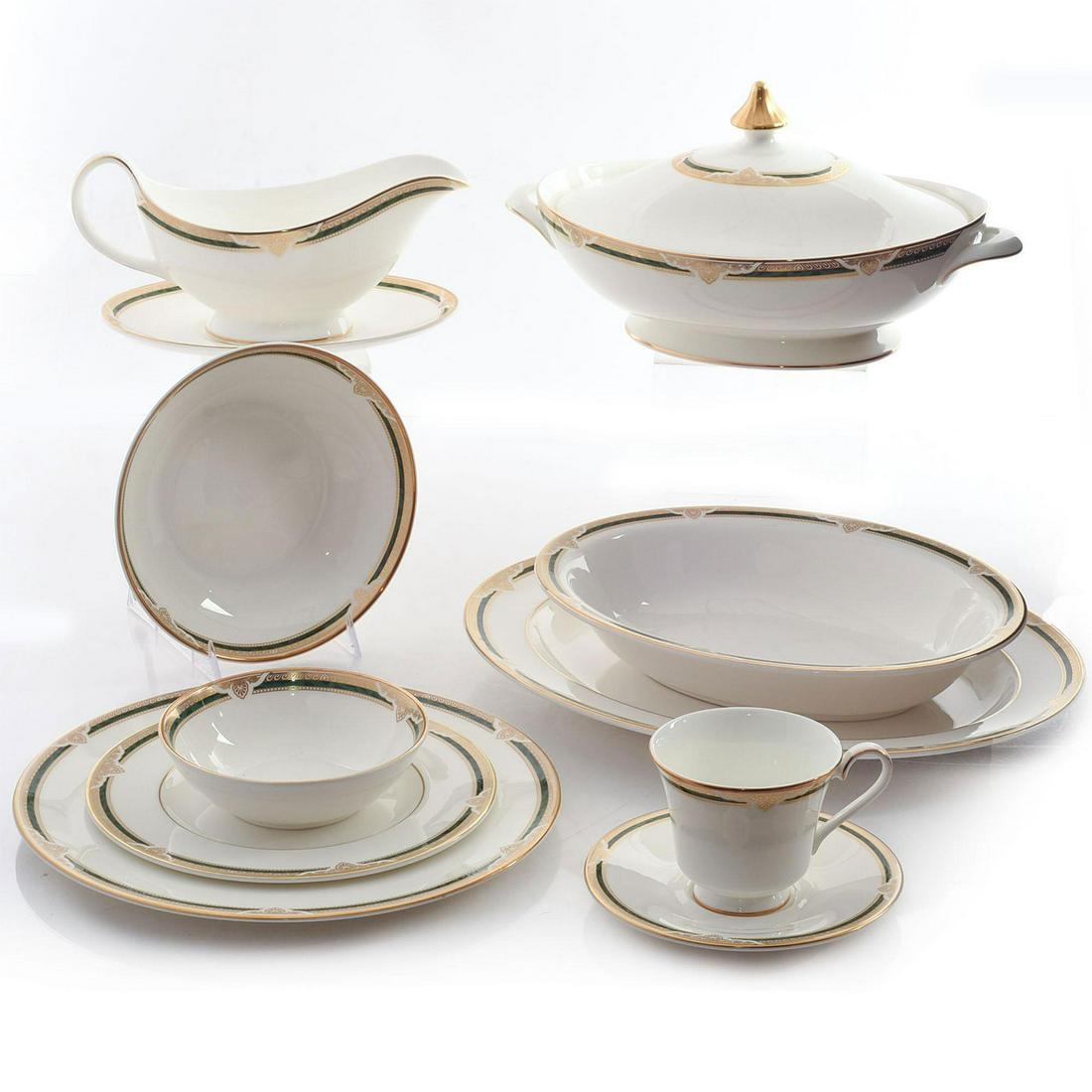 GROUPING OF ROYAL DOULTON FORSYTH DINNERWARE: 12 plates, 7 saucers, 8 bowls, 6 cups, gravy boat and lidded bowl. Fine china, green and gilded rim. Marked Royal Doulton Forsyth H5197 on the underside. Issued: 20th c. Dimensions: 15"W, largest Manu