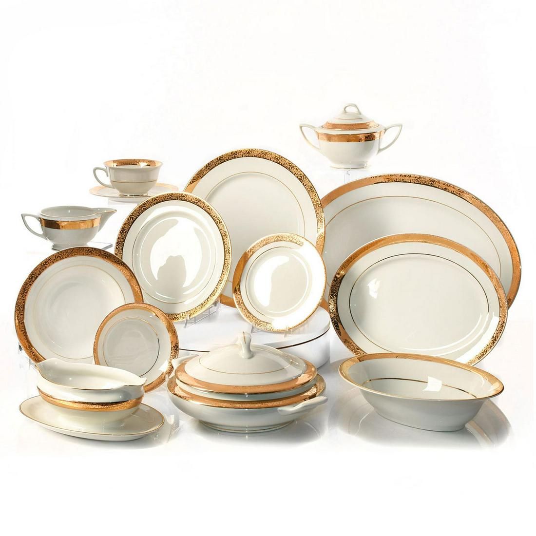 89 PIECE EMBASSY U.S.A. VITRIFIED CHINA DINNER SERVICE: American vitrified china, gilt. Includes gray quilt storage cases. This is a rare, almost entirely intact mid 20th century American dinner service, with profuse gilded decoration and highlights. 89 pi