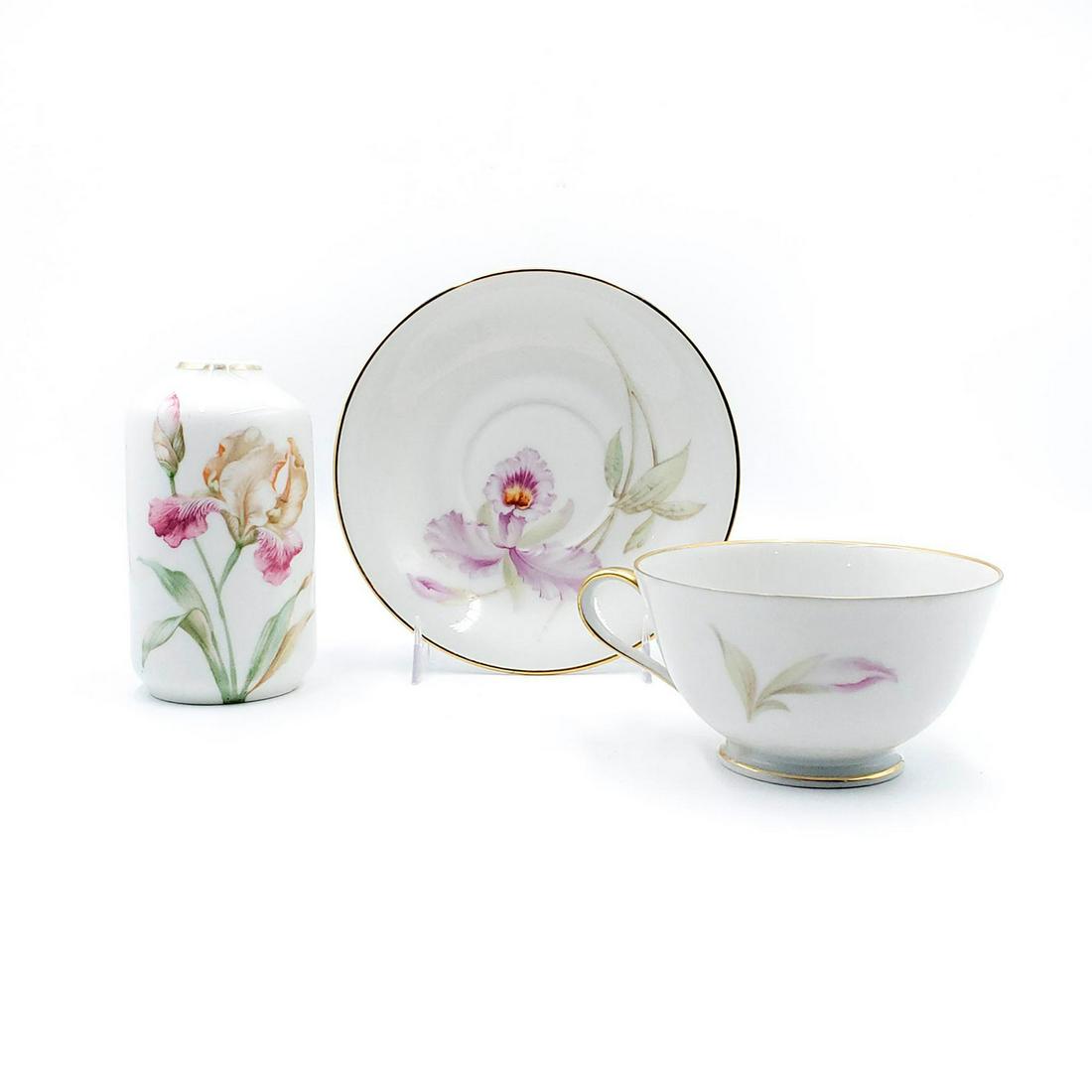 3 GERMAN CERAMIC CUP, SAUCER AND VASE SET: Glazed ceramic; floral design; gilt rim. Manufacturers backstamp. Issued: 20th c. Dimensions: 4.75"H, tallest Country of Origin: Germany
