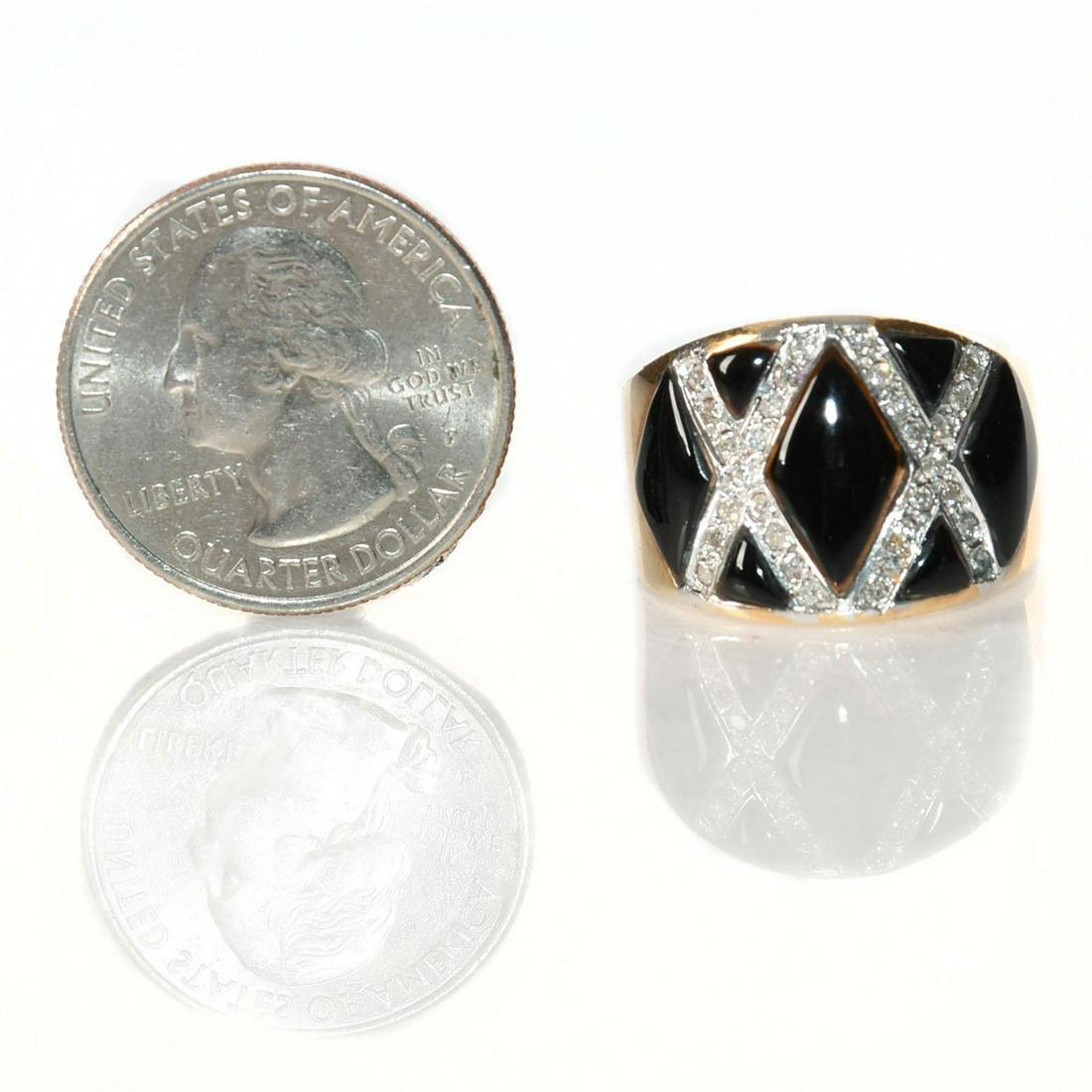 14 KARAT GOLD RING WITH DIAMONDS AND ENAMEL: Black enamel X pattern lozenges. Total weight approx. 10.8 grams. Issued: 20th c. Dimensions: Size 8.75 Country of Origin: United States