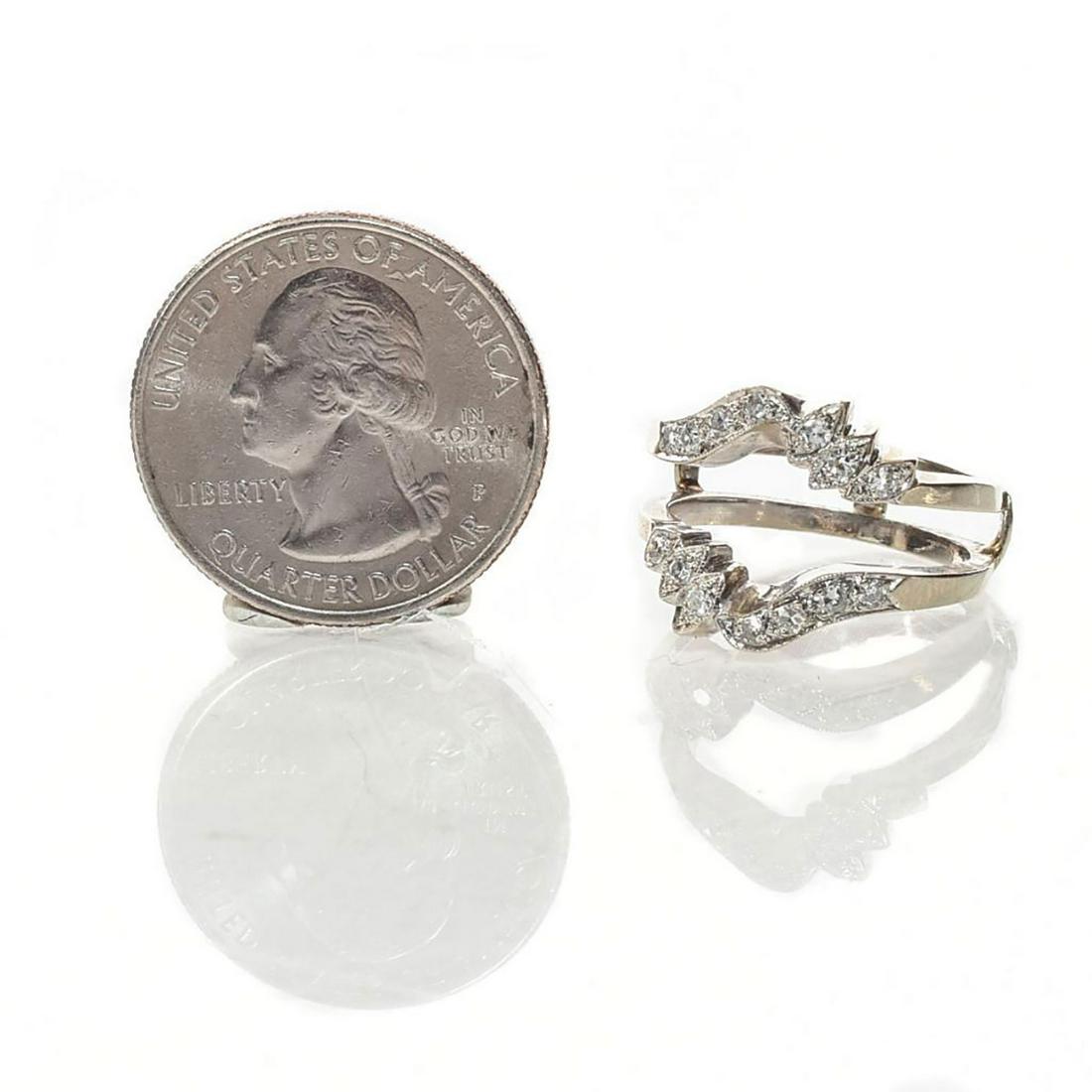 14 KARAT WHITE GOLD ABSTRACT DIAMOND RING: Hallmarked gold. Solitaire Enhancer. Dimensions: Size 7.5 Country of Origin: United States