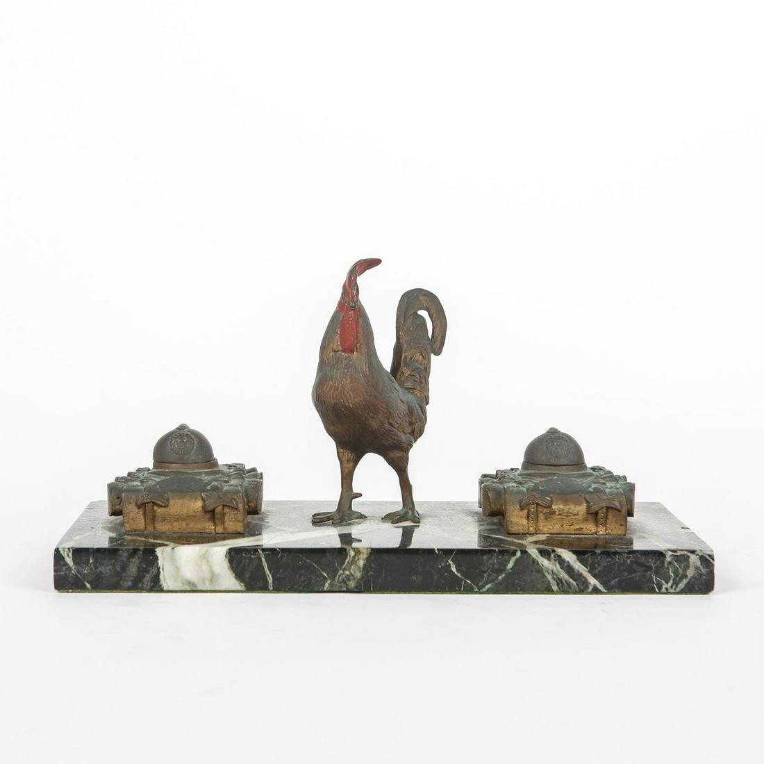 INKWELL, WW1 BELGIAN SOLIDER BACKPACK AND COCK DESIGN: Bronze inkwells and cock on marble slab base. Helmets on inkwell are in the style of WW1 Belgian soldiers, with lion design to front. Heavy patina to bronze. Issued: c. 1915 Dimensions: 11.75"L x 5.5"