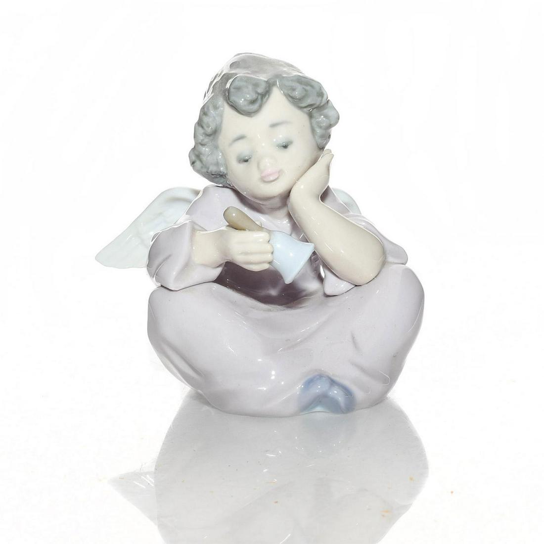 LLADRO FIGURINE, HEAVENLY CHIMES 01005723: Angels Collection; little angel ringing a bell. Glazed porcelain. Item number inscribed in base. Lladro backstamp. Includes original box. Artist: Francisco Polope Issued: 1990- 2005 Dimensions: 3.5"H,