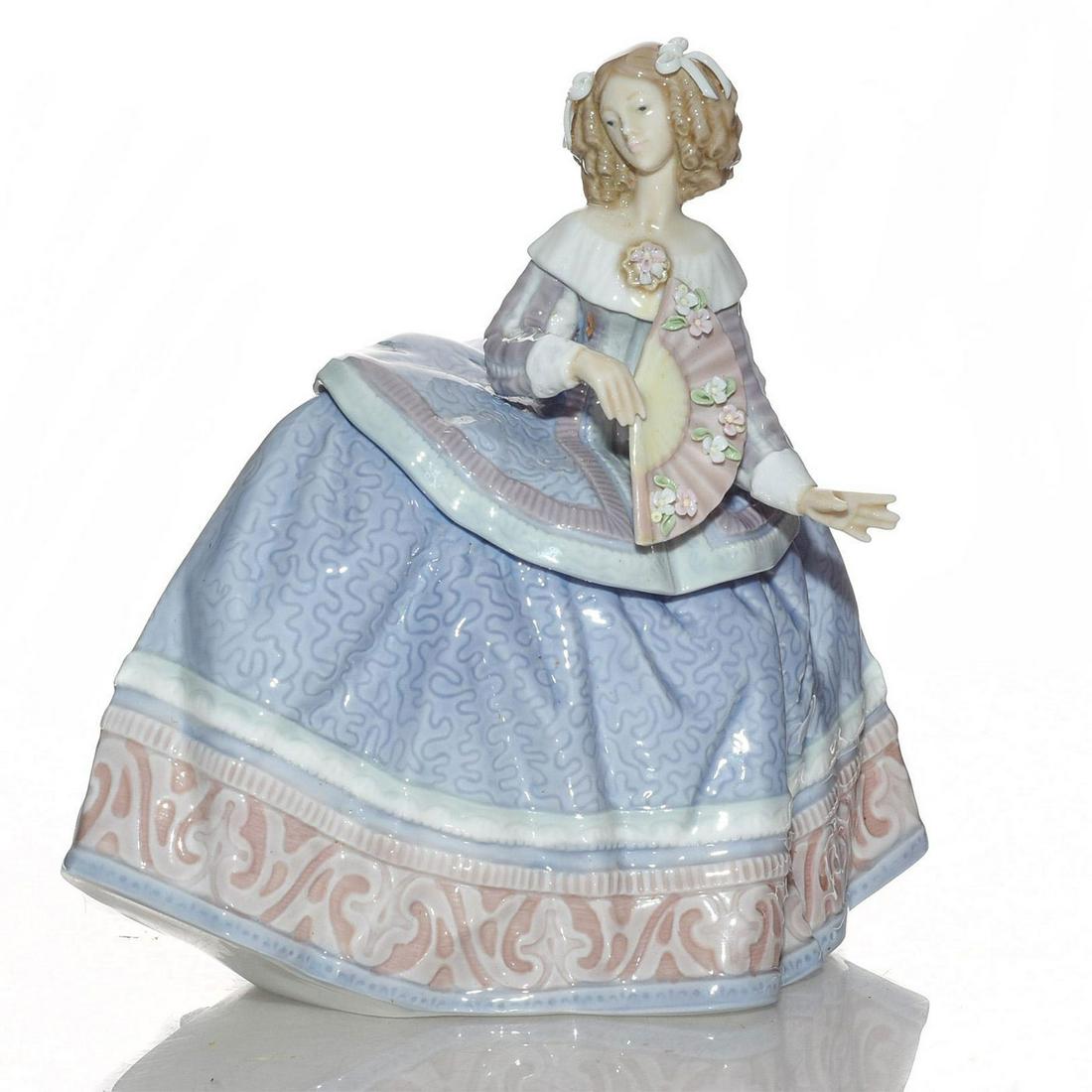 LLADRO FIGURINE, ISABEL 01005412: Elegant lady in gown holding a fan adorned with floral motifs. Porcelain; glazed. Lladro backstamp. Includes box. Artist: Jose Puche Issued: 1987-1989 Dimensions: 6"H Manufacturer: Lladro Country of O