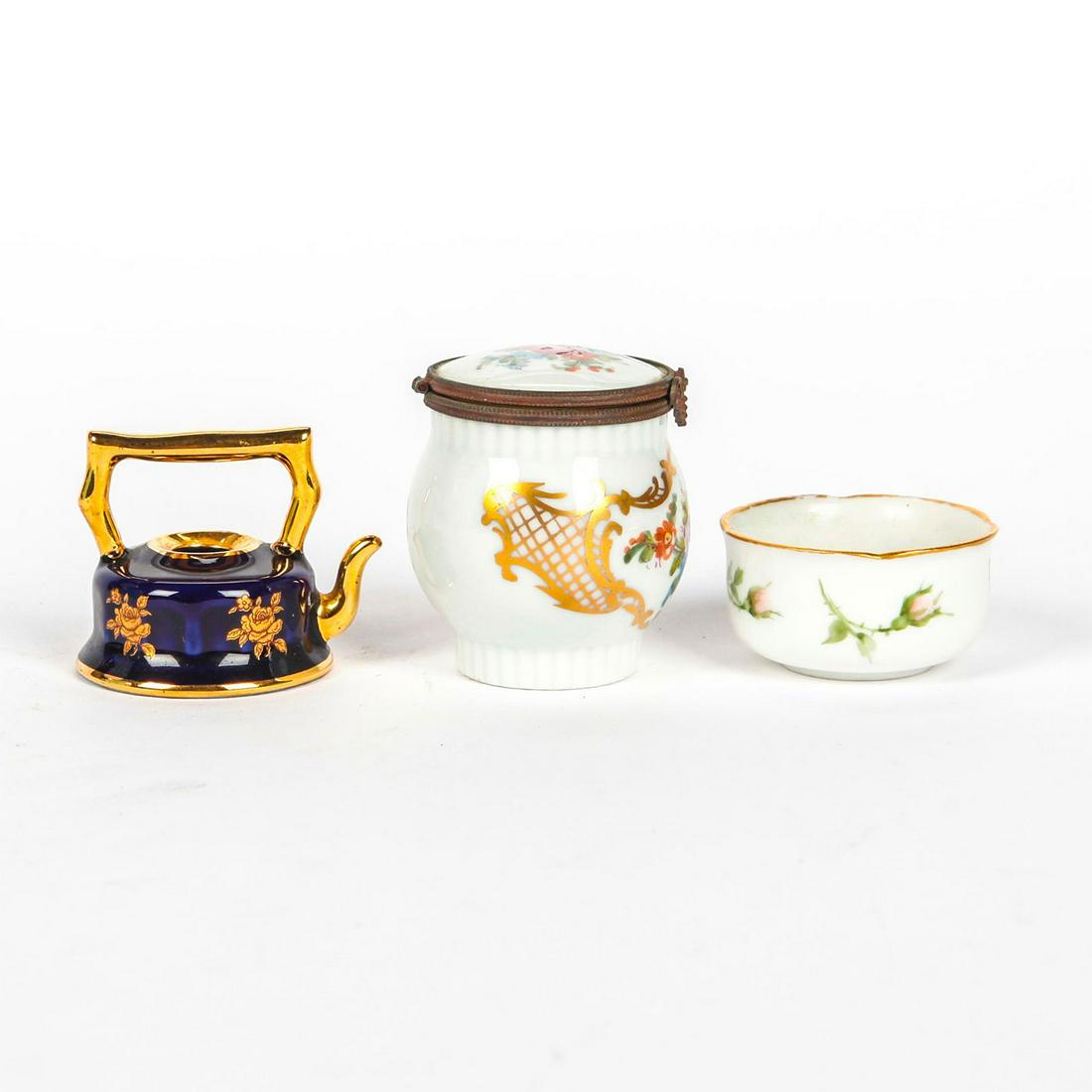 3 LIMOGES PORCELAIN MINIATURES: Teapot, salt cellar, and lidded jar. Each stamped Limoges. Issued: 20th c. Dimensions: 2.5"H, tallest Country of Origin: France