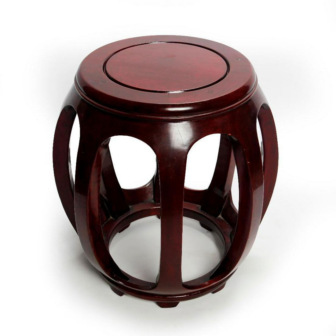 CHINESE CHERRY WOOD GARDEN SEAT: Open design stool with red stain. Use related wear, minor dings and dents. Issued: 20th -21st c. Dimensions: 18"H x 16"C Country of Origin: China