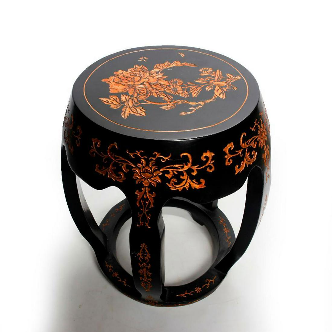 CHINESE GARDEN SEAT, BLACK WITH GOLD FLORAL CARVING: Open design stool, black lacquered wood construction. Use related wear, minor dings and dents. Issued: 20th -21st c. Dimensions: 18"H x 14.5"C Country of Origin: China