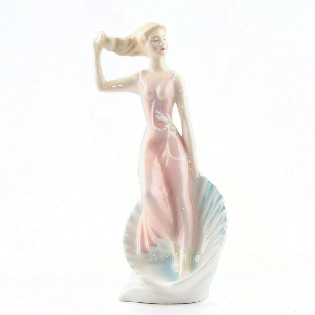 ROYAL DOULTON FIGURINE, SEA SPRITE HN2191: Peggy Davies captures the beauty of the years between childhood and adulthood in Royal Doulton's Teenagers series. In a world where old fashioned values seems to be long gone, a tradition of craftsman