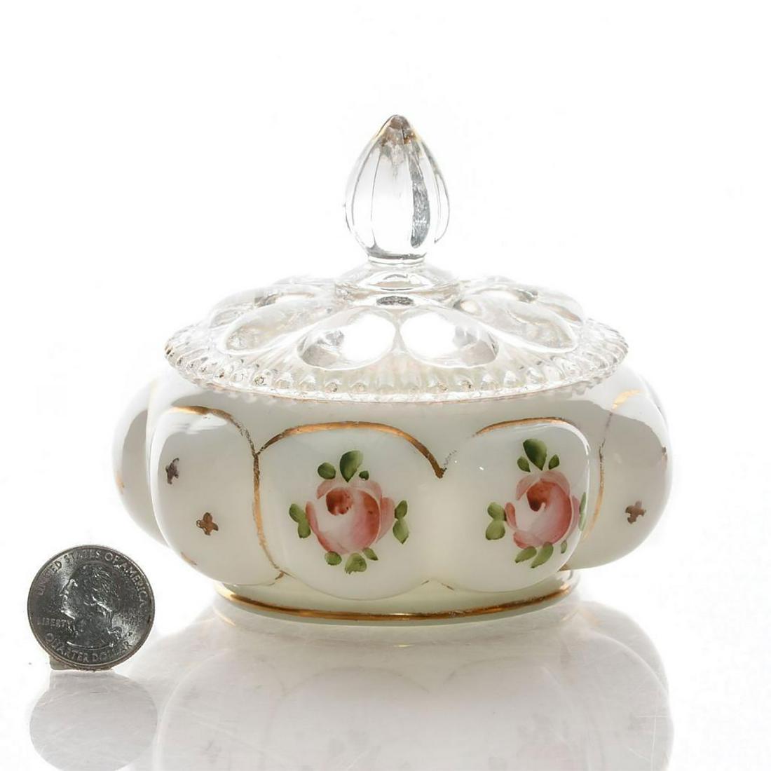 VINTAGE FENTON TYNDALE POWDER JAR WITH LID: Handpainted roses, accented in gold gilt. Tyndale label to base. Issued: 20th c. Dimensions: 4.25"H lid Manufacturer: Fenton Tyndale