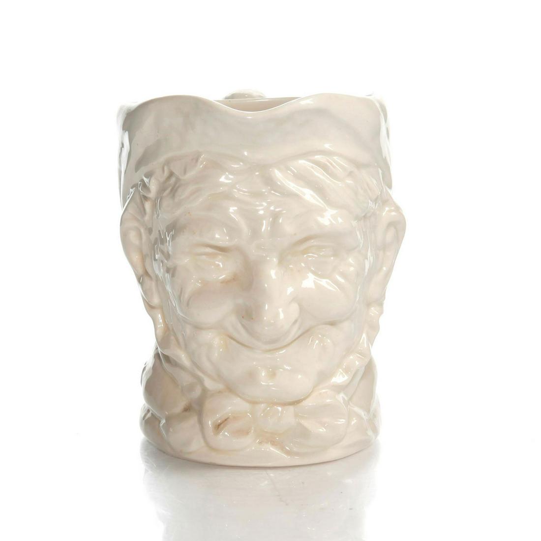 LG ROYAL DOULTON CHARACTER JUG, GRANNY D5521: Ivory glazed ceramic jug with tied yarn handle. Doulton backstamp. Artist: Harry Fenton Issued: 1941-1983 Dimensions: 6.5"H Manufacturer: Royal Doulton Country of Origin: England
