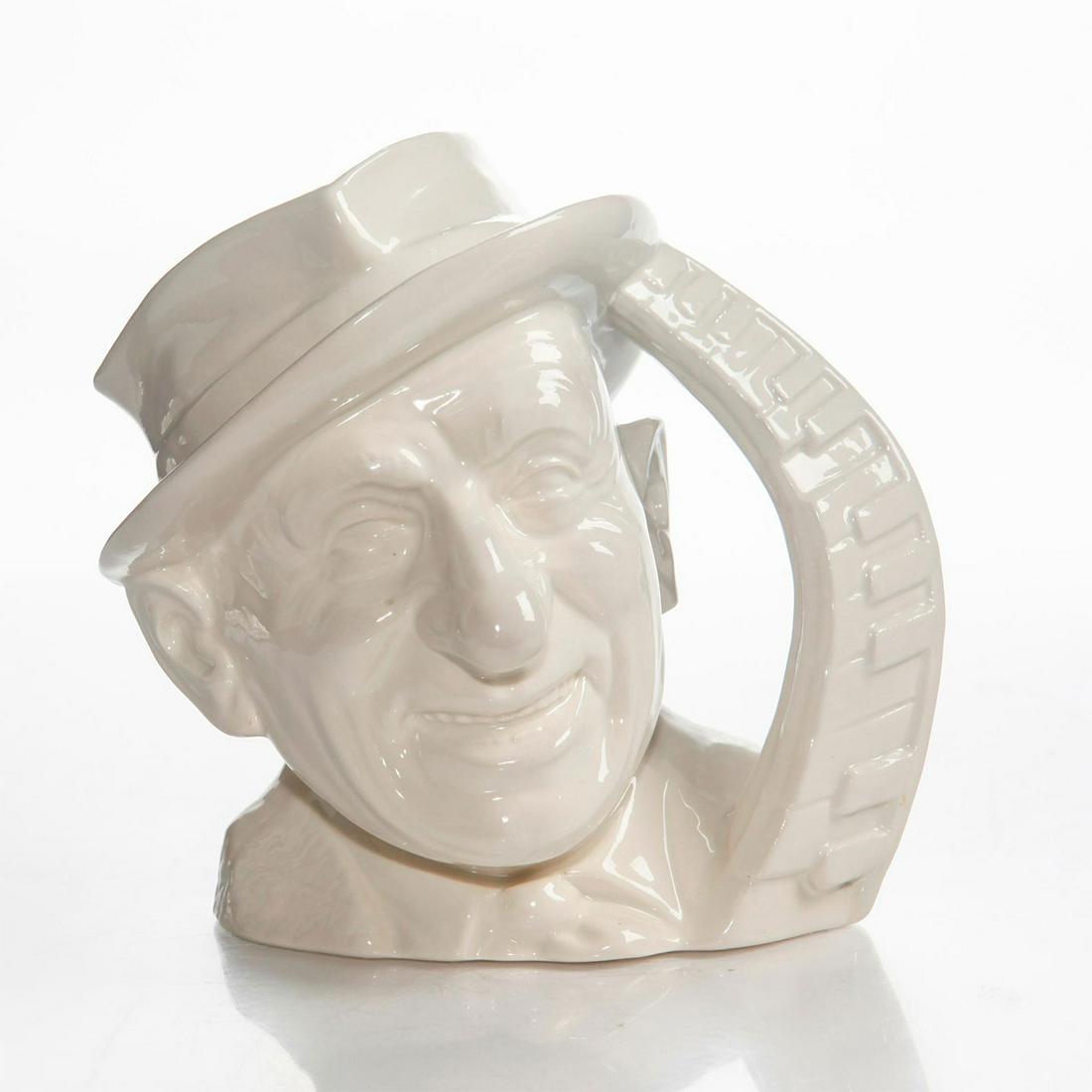 LG ROYAL DOULTON CHARACTER JUG, JIMMY DURANTE D6708: Ivory glazed ceramic jug with piano keyboard handle. Doulton backstamp. Artist: David Biggs Issued: 1985-1988 Dimensions: 7.5"H Manufacturer: Royal Doulton Country of Origin: England