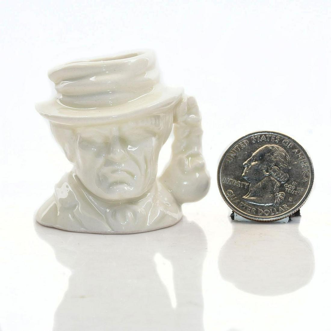 RARE TINY ROYAL DOULTON CHARACTER JUG, BILL SIKES: Undecorated Prototype ivory glazed jug. Doulton backstamp. Artist: Stanley Taylor Issued: 1994 Dimensions: 1.5"H Manufacturer: Royal Doulton Country of Origin: England