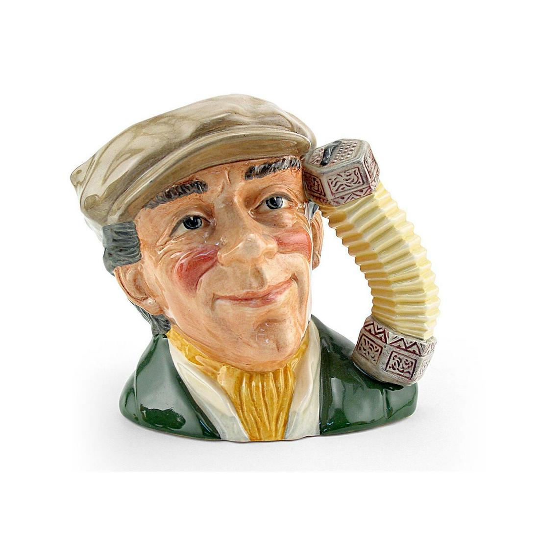 BUSKER D6775 - LARGE - ROYAL DOULTON CHARACTER JUG: Royal Doulton Character Jug, The Busker D6775 (grey cap, green coat, yellow scarf). Designed by Stanley J. Taylor. Series: The London Collection, issued 1988 - 1991. Size 6.5"H (Large)From its roots w