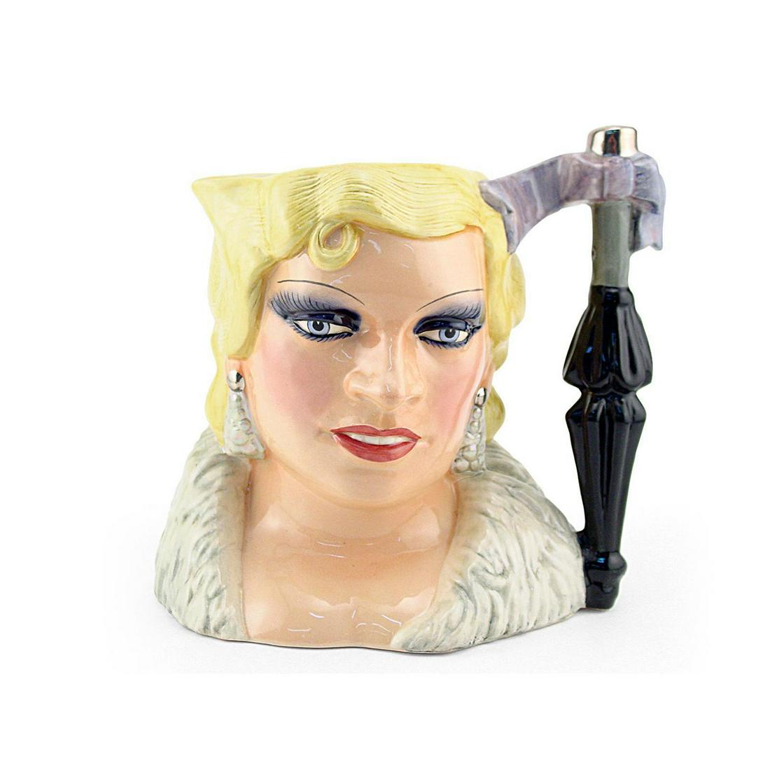 MAE WEST D6688 - LARGE - ROYAL DOULTON CHARACTER JUG: Mae West D6688 (yellow hair, white feather dress). Designed by Colin M. Davidson. Series: The Celebrity Collection, issued 1983 - 1986. Size: 7"H (Large)From her screen debut in 1932, Mae West (1892 -
