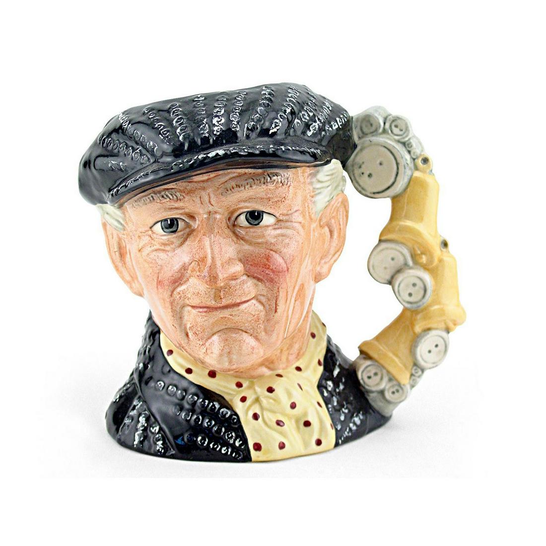 PEARLY KING D6760 - LARGE - ROYAL DOULTON CHARACTER JUG: Pearly King D6760 (Black cap and jacket with silver buttons, yellow scarf with red polka-dots). Designed by Stanley J. Taylor. Series: The London Collection, issued 1987 - 1991. Size: 6.75"H (Large)Th