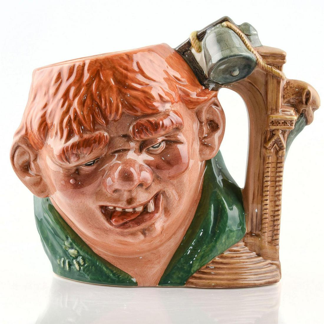 QUASIMODO D7108 - LARGE - ROYAL DOULTON CHARACTER JUG: Quasimodo D7108 (green, orange, and tan coloration). Designed by David B. Biggs. Series: Characters from Literature, issued 1998 in limited edition of 2,5000. Size: 7"H (Large)Quasimodo was the hunchb