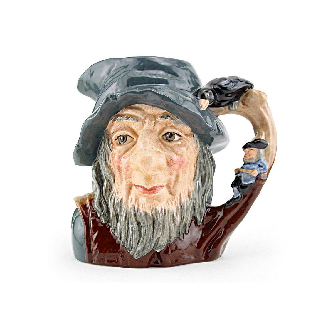 RIP VAN WINKLE D6438 - LARGE - ROYAL DOULTON CHARACTER: Rip Van Winkle D6438 (grey-blue cap; brown robes; figure dressed in blue resting against tree). Designed by Geoff Blower. Series: Characters from Literature, issued 1955 - 1995. Size: 6.5"H (Large)In 