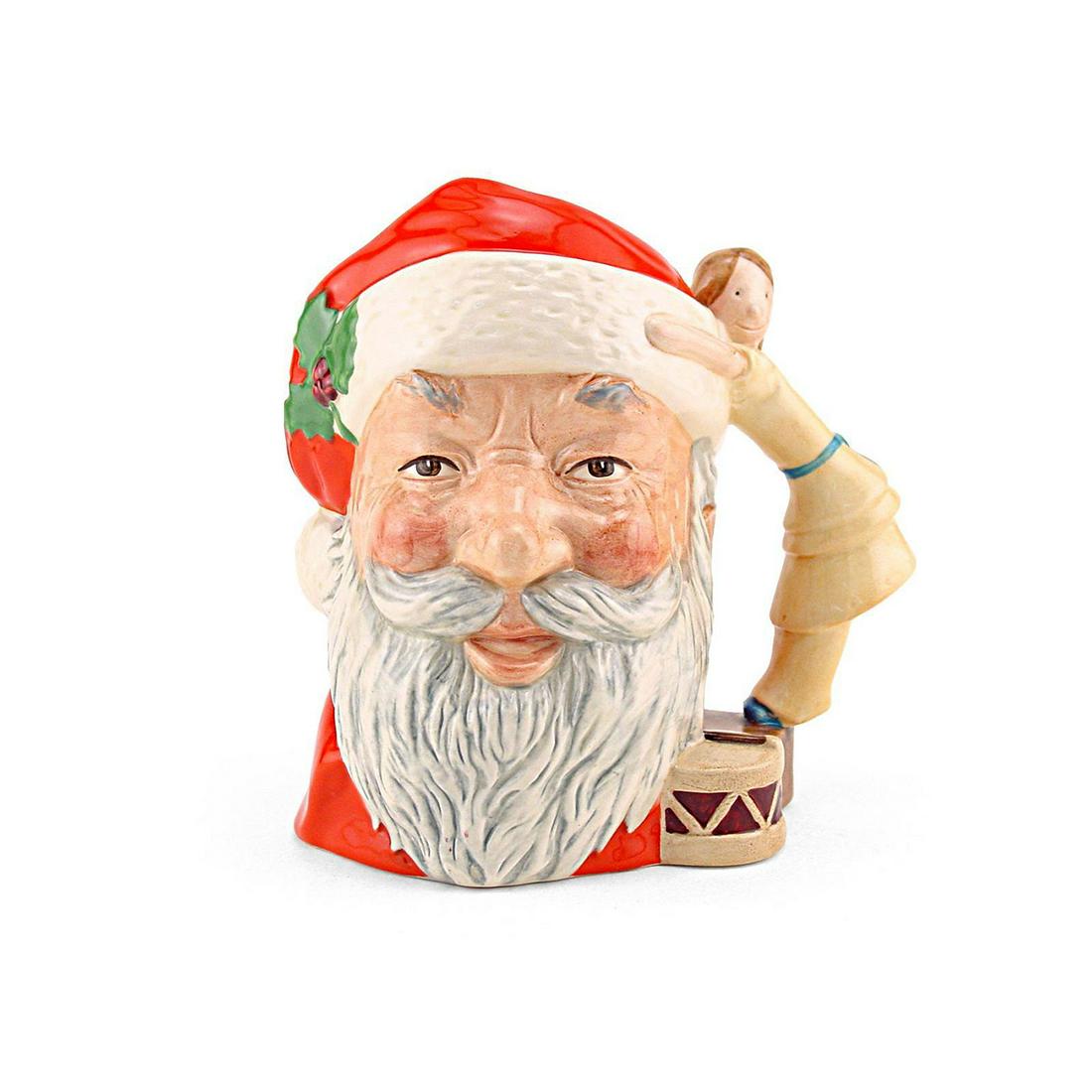 SANTA CLAUS DOLL ON DRUM D6668 - LARGE - ROYAL DOULTON: Santa Claus with Doll and Drum Handle D6668 (red, white and light brown coloration). Designed by Michael Abberley, Issued 1981 - 1981. Size: 7.5"H (Large) The Santa Claus jug was introduced in 1981 an