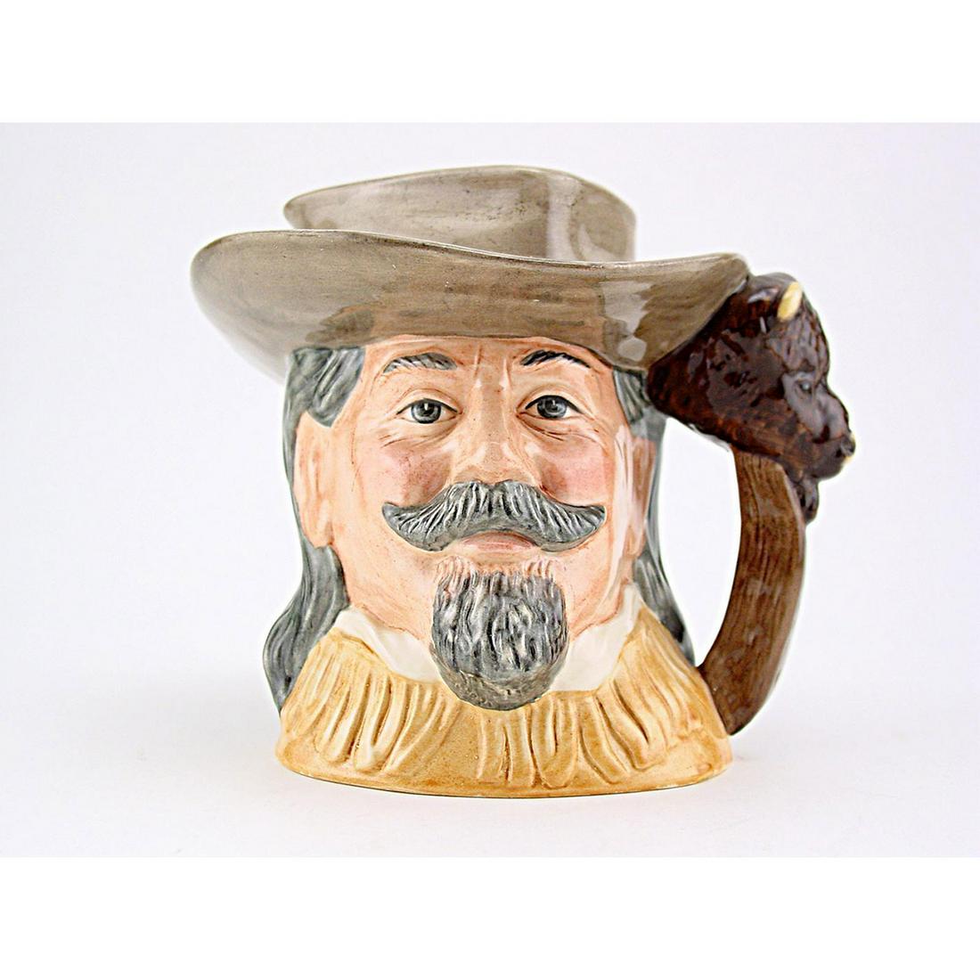 BUFFALO BILL D6735 - ODD SIZE - ROYAL DOULTON CHARACTER: Royal Doulton Character Jug, Buffalo Bill D6735 (light brown hat and buckskin jacket). Designed by Robert Tabb nor. Series: The Wild West Collection, issued 1985 - 1989. Size: 5.5"H (odd)William Frede