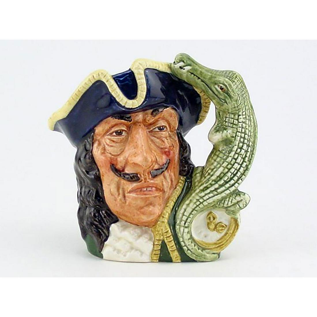 CAPT HOOK OLD D6605 - MINI - ROYAL DOULTON CHARACTER: Royal Doulton Character Jug, Capt Hook Old D6605 (blue tricorn trimmed with yellow; green coat trimmed with yellow; white ruffles at the neck). Designed by Max Henk and David B. Biggs, issued 1965 - 1