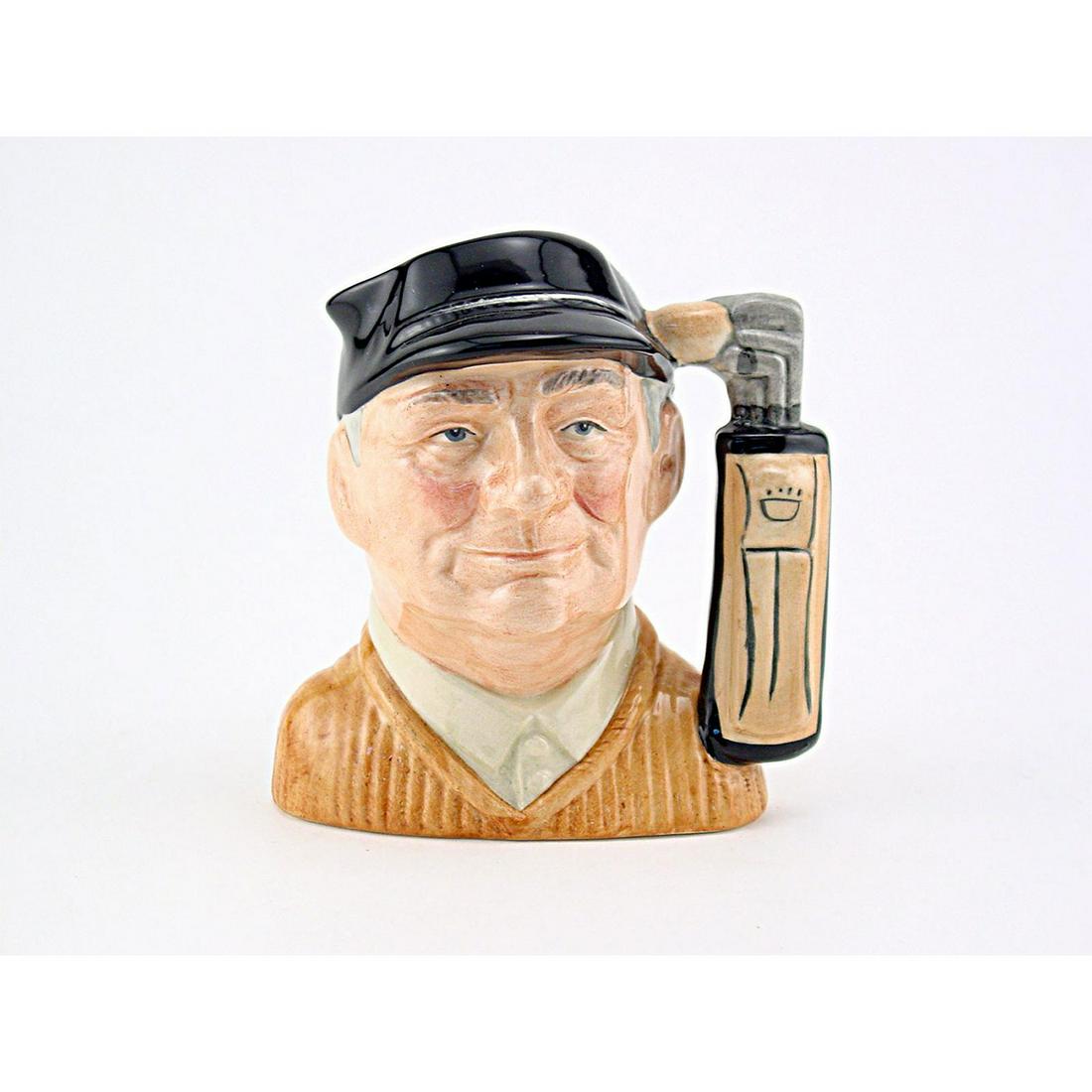GOLFER D6757 - MINI - ROYAL DOULTON CHARACTER JUG: Royal Doulton Character Jug, Golfer in light brown sweater D6757 (blue cap; brown sweater; tan shirt; light brown golf bag). Designed by David B. Biggs, issued 1987 - 1991. Size: 2.5"H (mini)This Golf