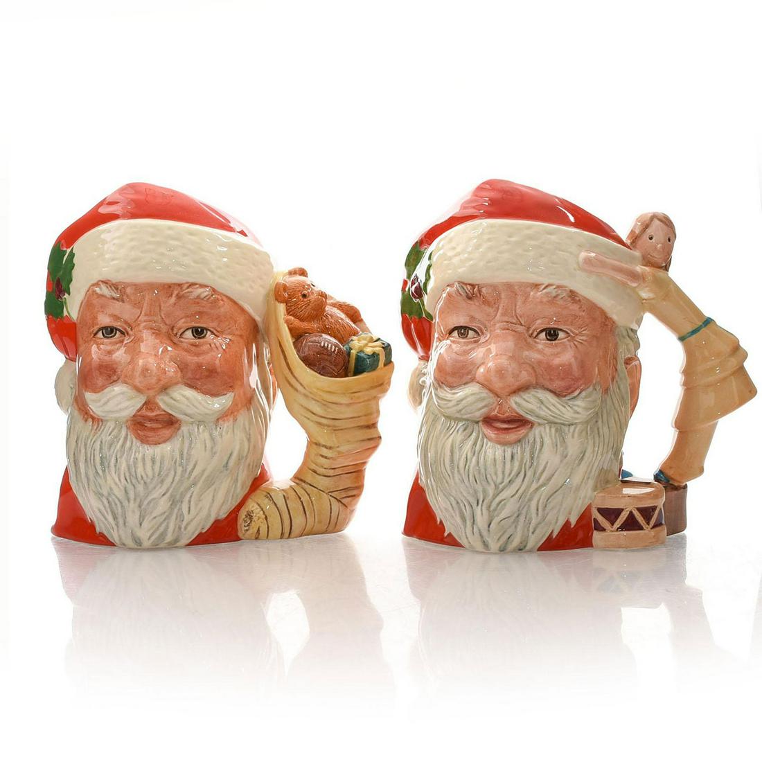 2 ROYAL DOULTON LG CHARACTER JUGS, SANTA CLAUS: Handles: stuffed stocking, child standing on drum, hugging Santa. Issued: 20th c. Dimensions: 7"H, tallest Manufacturer: Royal Doulton Country of Origin: England