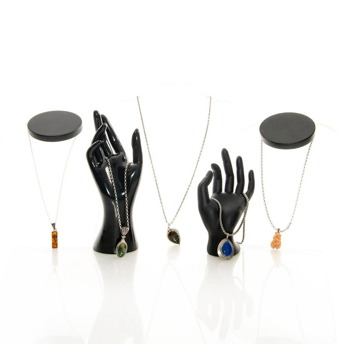 GROUP OF 5 925 SILVER PENDANT CHAINS: With various stones. Includes one teardrop shaped locket. Issued: c. 1980 Dimensions: 1.5"H x 1.25"W, largest Provenance: David Farin Collection