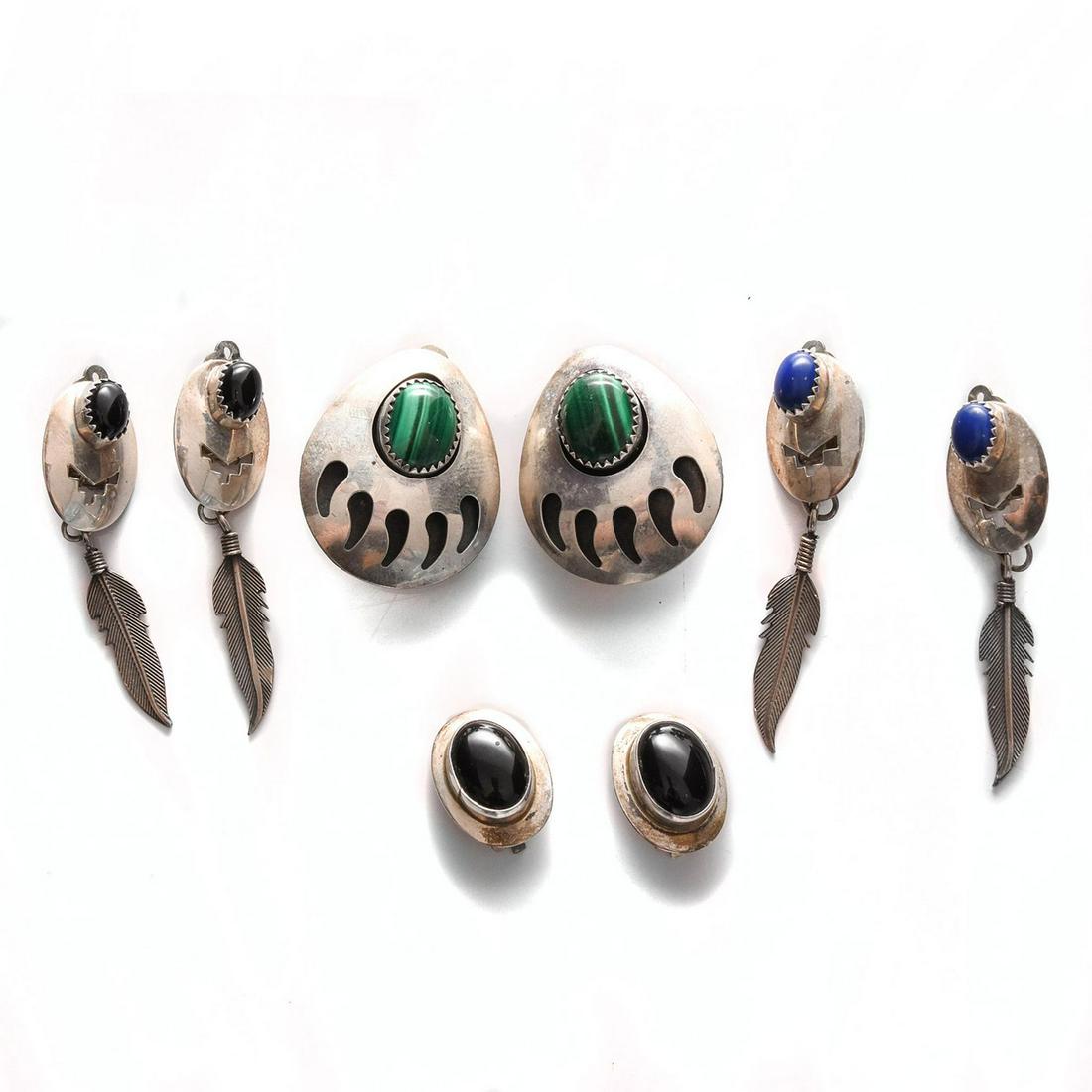 4 PAIRS, NATIVE AMERICAN STERLING SILVER EARRINGS: Each with clip on clasp, inset stone. Total weight is approximately 27.4g. Issued: 20th c. Dimensions: 1.25"H, largest Provenance: David Farin Collection