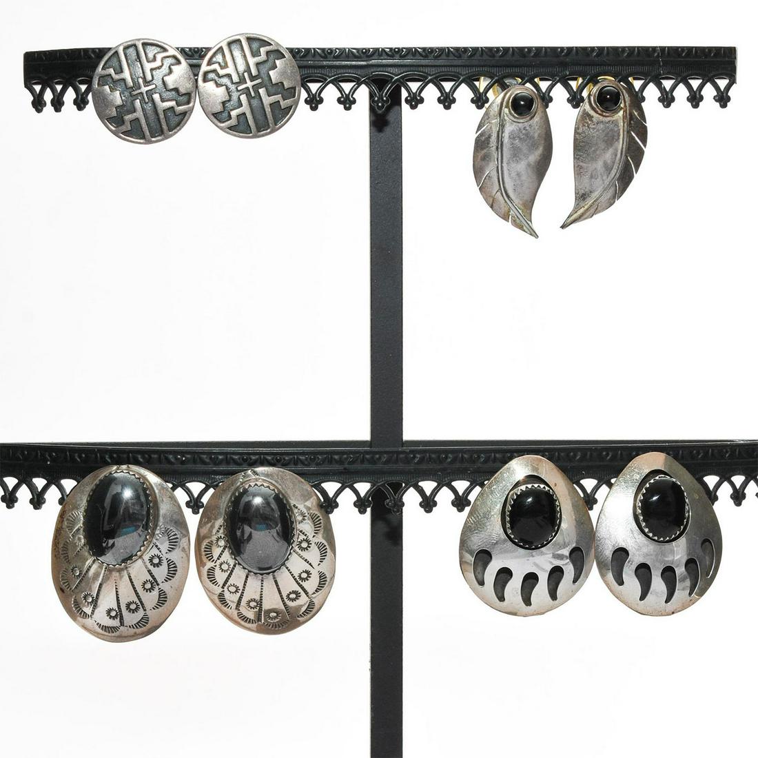 4 PAIRS, NATIVE AMERICAN STERLING SILVER EARRINGS: American Southwest design, 2 w. inset black stones. Total weight is approximately 31.7g. Issued: 20th c. Dimensions: 1.25"H, largest Country of Origin: United States Provenance: David Farin Collection