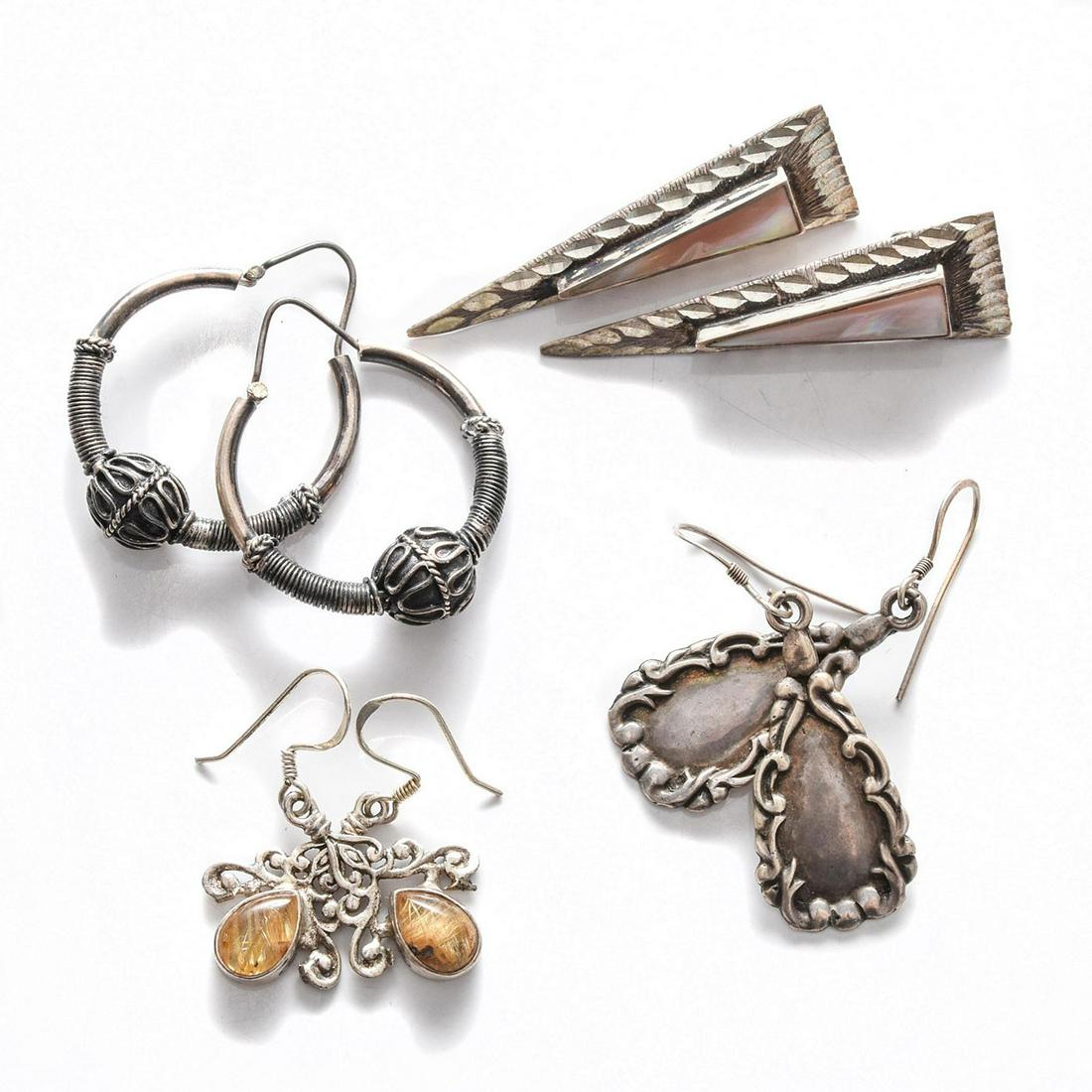 4 PAIRS, STERLING SILVER EARRINGS: Geometric designs, 2 w. inset stones. Total weight is approximately 25.4 grams. Issued: 20th c. Dimensions: 2"H, largest Country of Origin: United States Provenance: David Farin Collection
