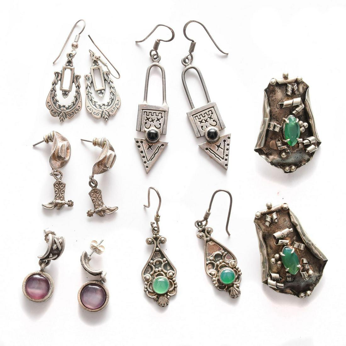 6 PAIRS, STERLING SILVER EARRINGS: Inset with green, purple, black stones. Total weight is approximately 53g. Issued: 20th c. Dimensions: 2.5"H, largest Provenance: David Farin Collection