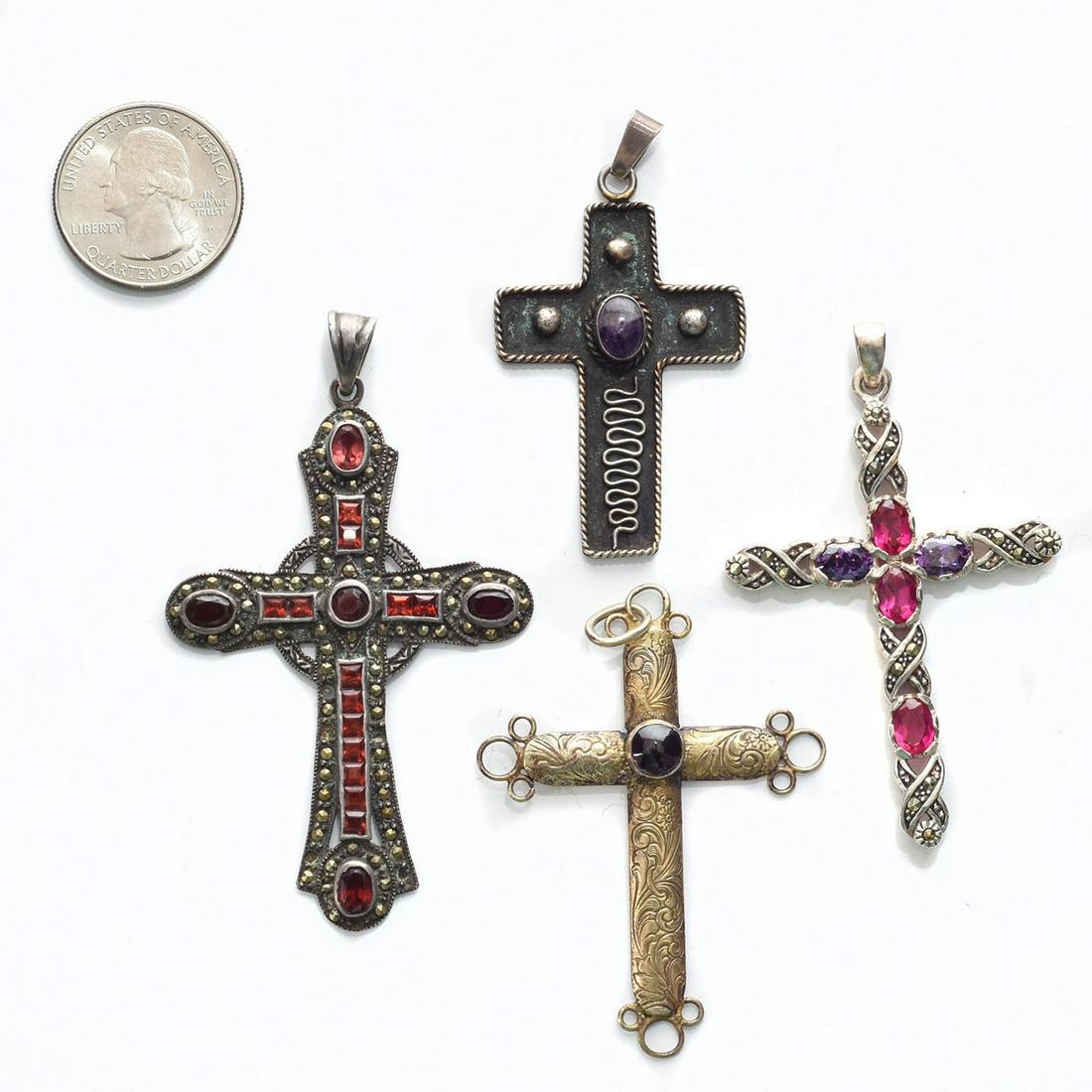 4 CRUCIFIX NECKLACE PENDANTS MARKED STAINLESS: Onyx, glass and other stones on crosses. Total weight 42g. Issued: 20th C. Dimensions: 3"L Provenance: David Farin Collection