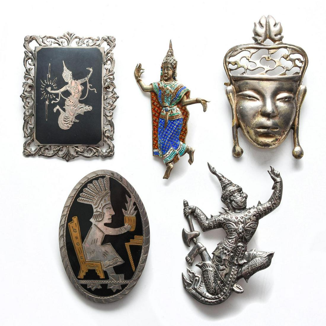 GROUP OF 5 925 SILVER PENDANT PINS, ALLEGORICAL THEMES: Four pins with Buddhist and Hindu motifs, one Mesoamerican. Issued: c. 1980 Dimensions: 2.5"H x 2.5"W, largest Provenance: David Farin Collection