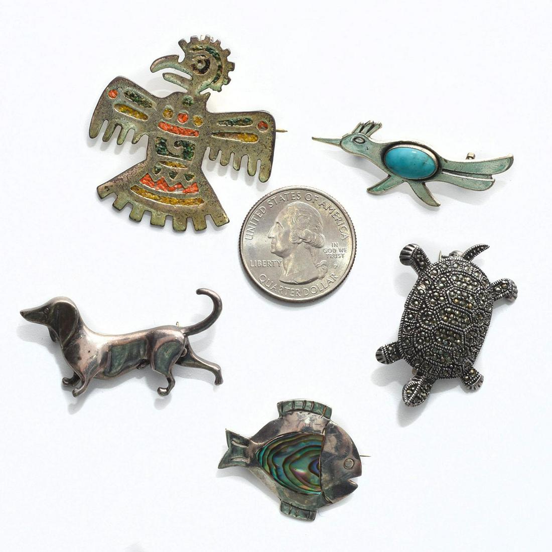 GROUP OF 5 925 SILVER PENDANT PINS, ANIMAL THEMES: Roadrunner, fish with abalone, Thunderbird, turtle, dachshund. Issued: c. 1980 Dimensions: 1.75"H x 1.75"W, largest Provenance: David Farin Collection