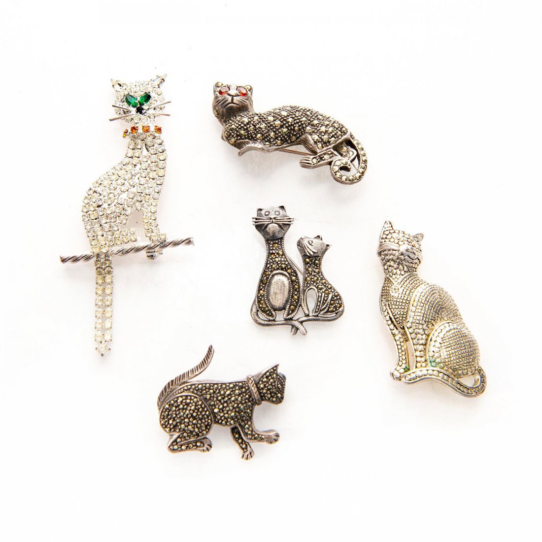 GROUP OF 5 VINTAGE MARCASITE PENDANT BROOCH PINS: A grouping of cat themed jewelry. Two with stones. Issued: c. 1980 Dimensions: 3.5"L x 1.75"W, largest Provenance: David Farin Collection